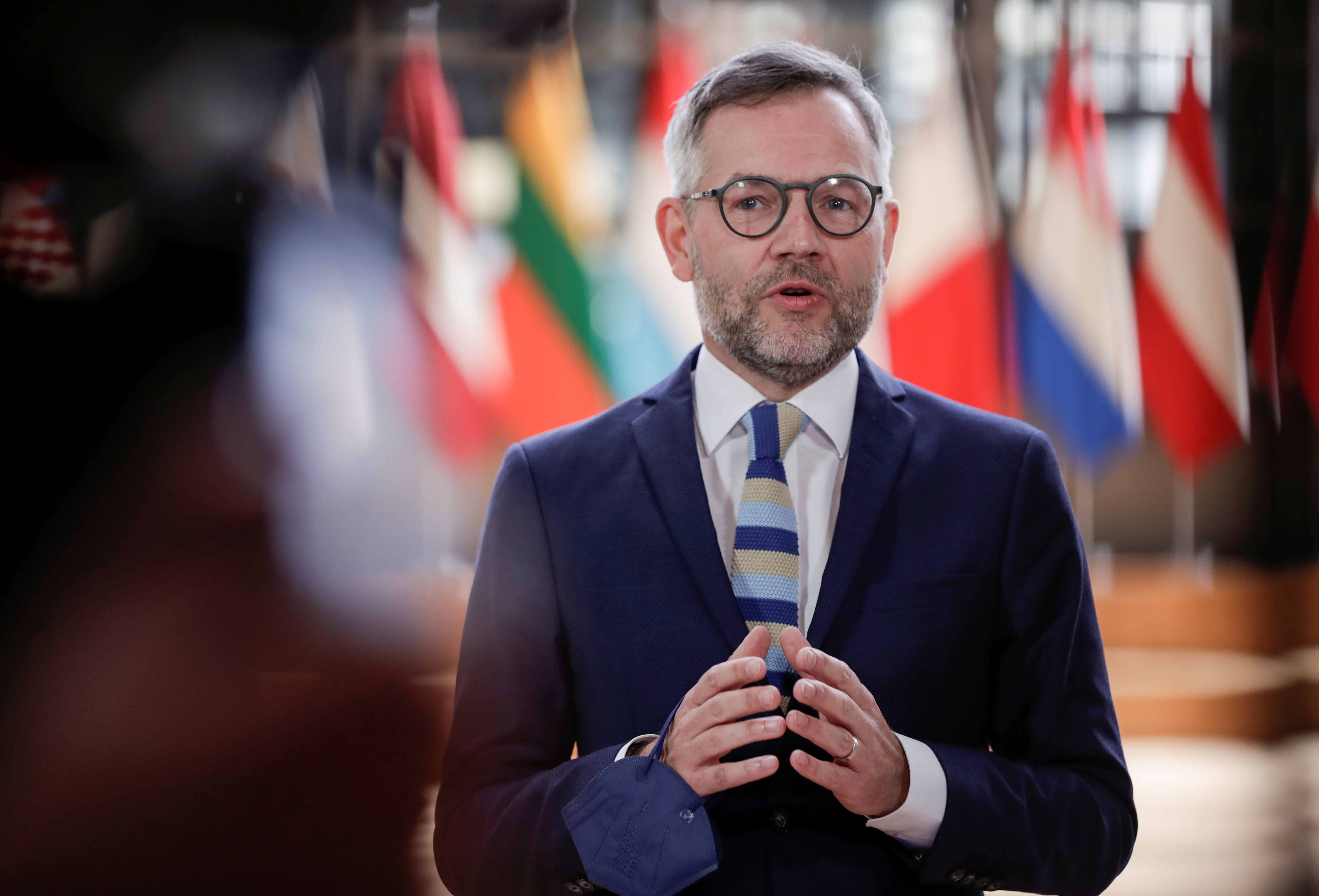 German Minister of State for Europe, Michael Roth gestures as he speaks at the start of the European affairs ministers meeting in Brussels, Belgium, May 11, 2021. Olivier Hoslet/Pool via REUTERS