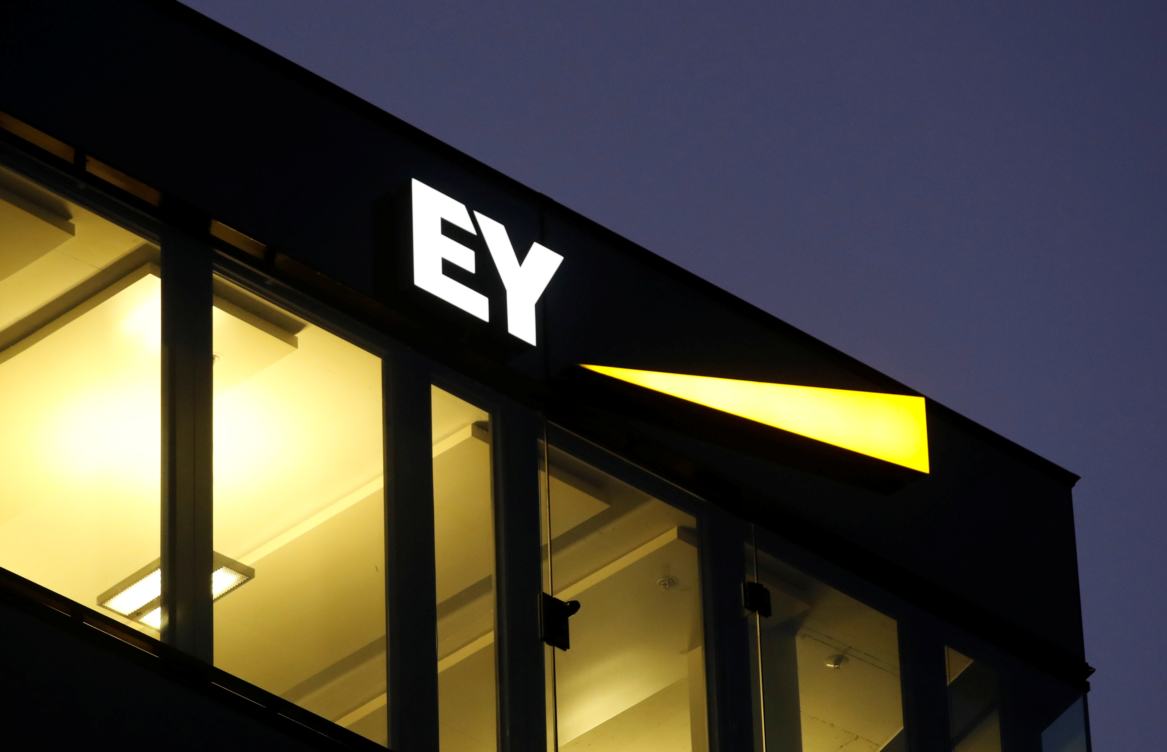 Logo of Ernst & Young is seen at a branch in Zurich