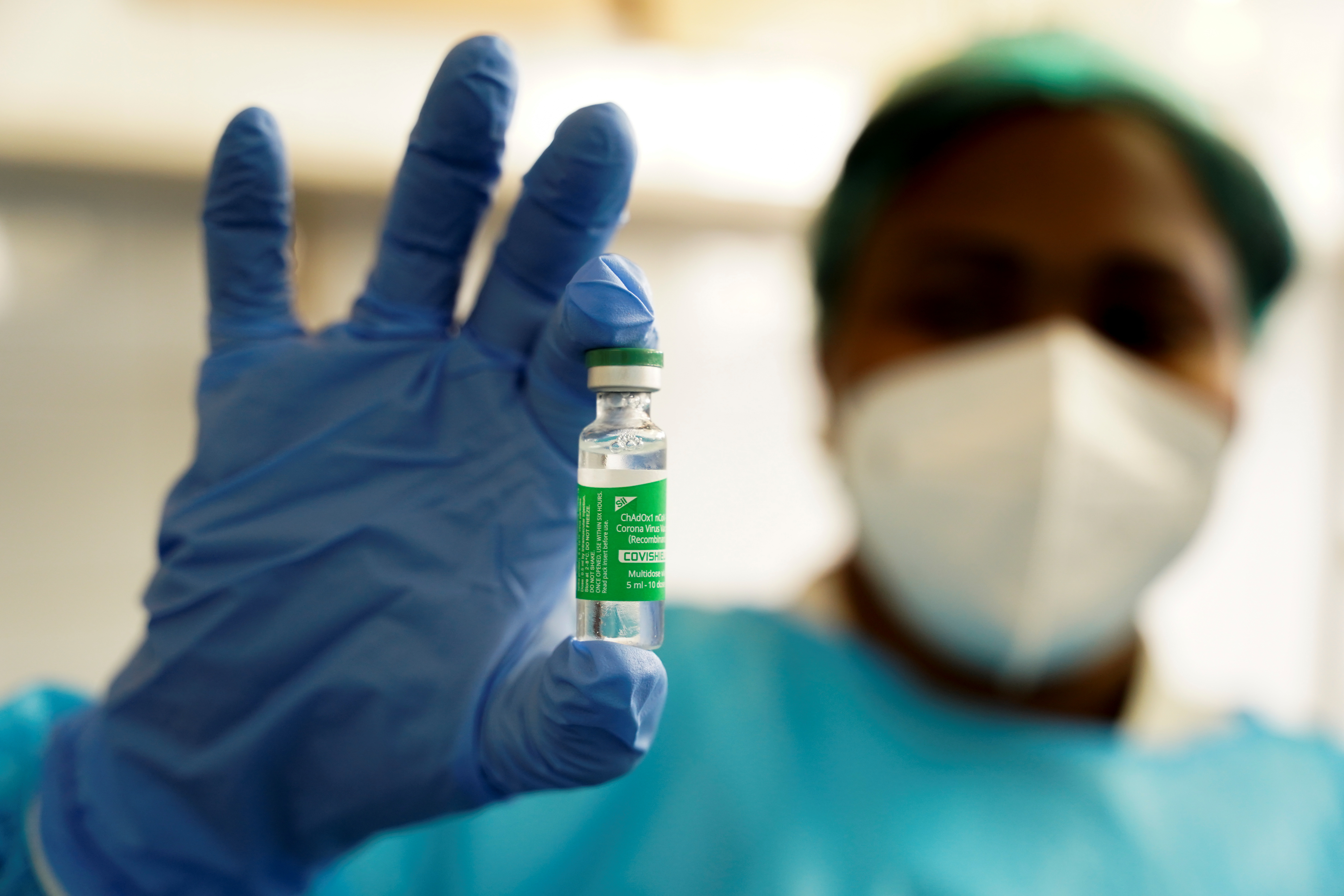 A nurse holds up a vial of the AstraZeneca coronavirus disease (COVID-19) vaccine at the Ngaliema Clinic in Kinshasa