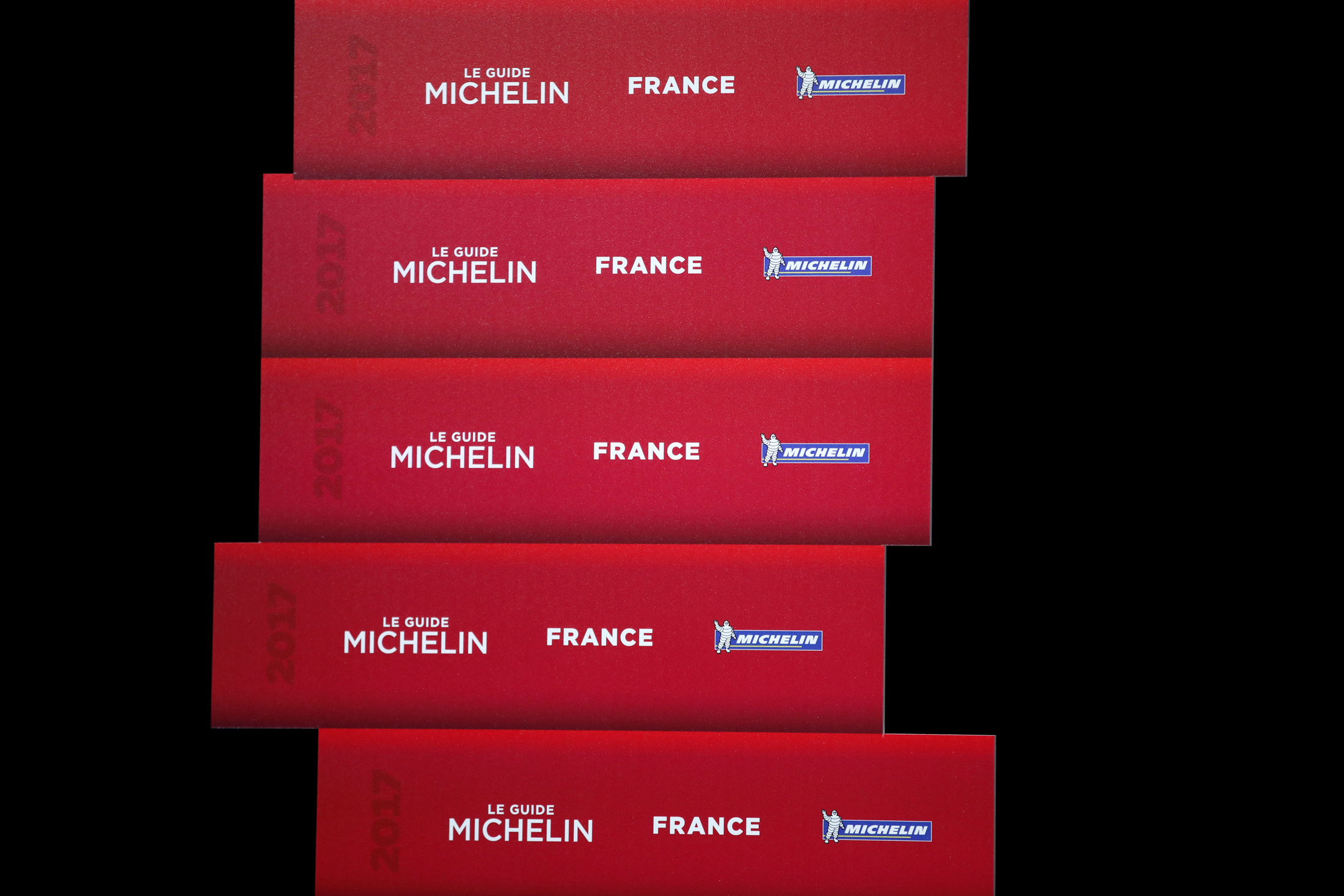 Logos of the new 2017 annual Michelin restaurant guide are seen during the announcement of the newly-promoted chef in Paris