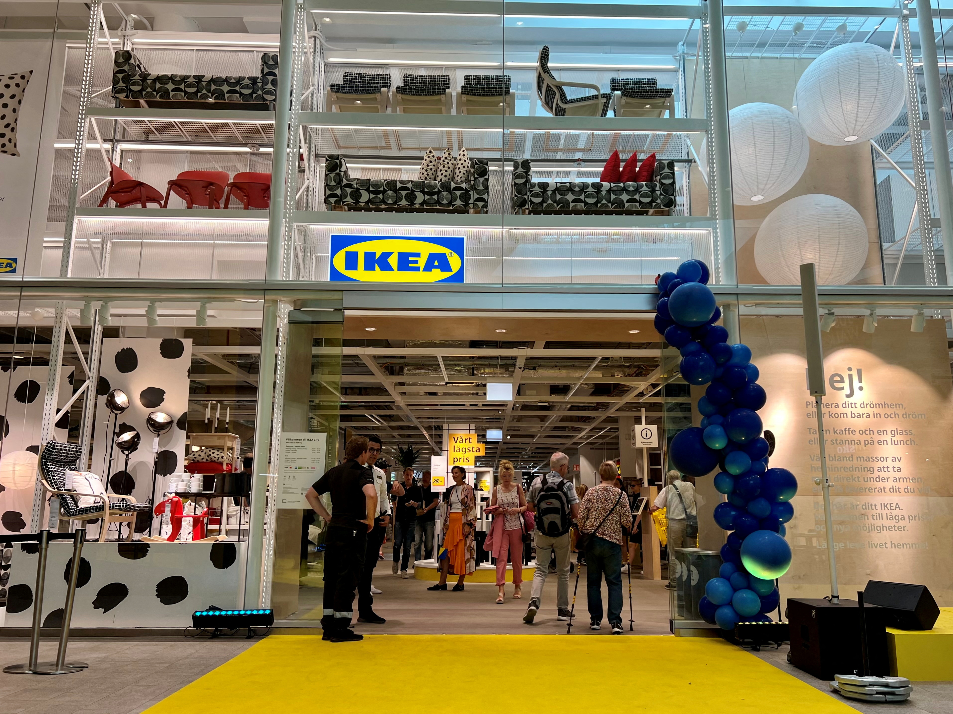 People enter an inner-city IKEA store in Stockholm, Sweden