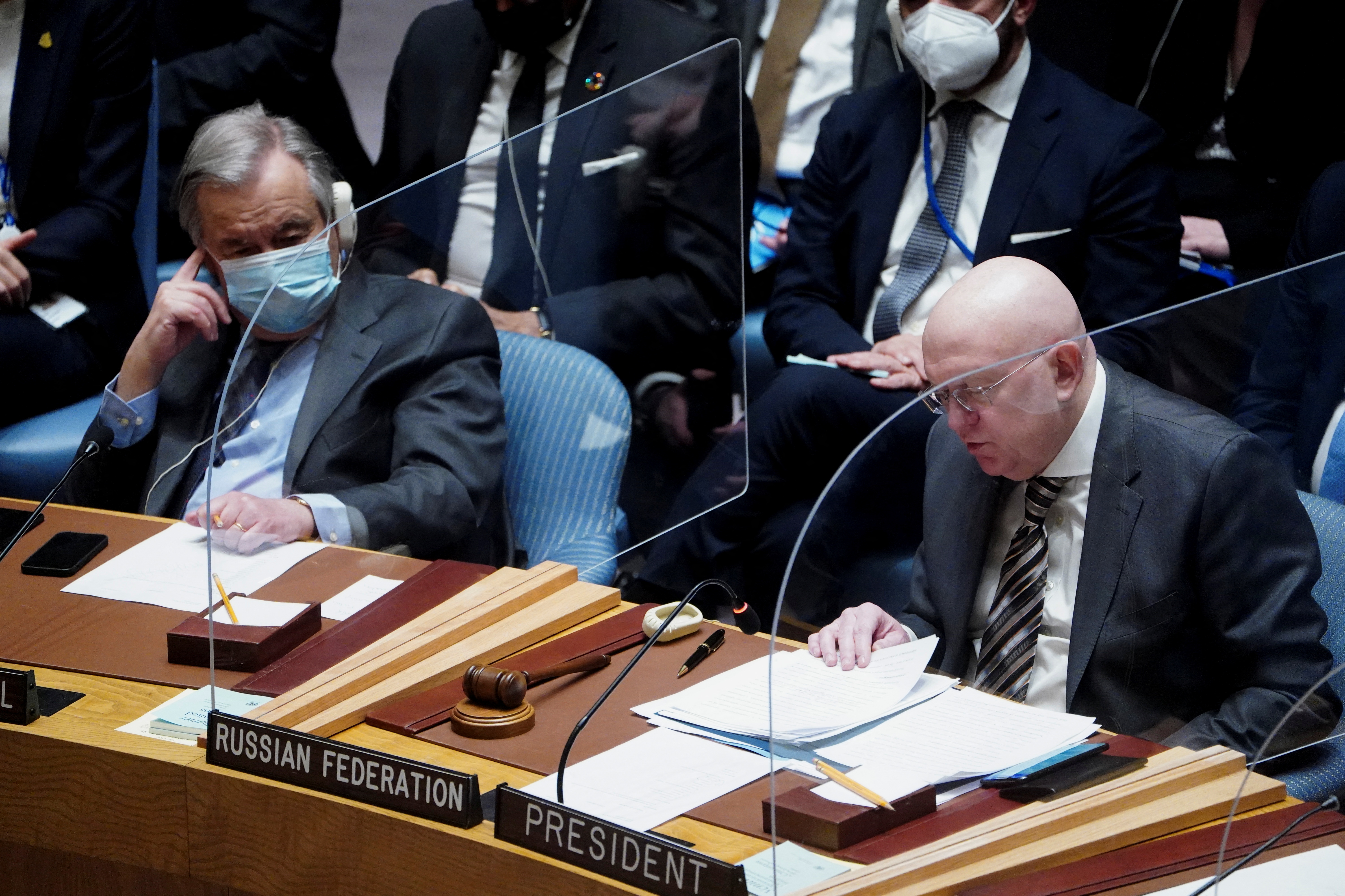 United Nations Secretary-General Antonio Guterres and Russia's Ambassador to the United Nations Vassily Nebenzia attend the United Nations Security Council meeting to discuss the ongoing crisis in Ukraine with Russia, in New York City, U.S., February 23, 2022. REUTERS/Carlo Allegri