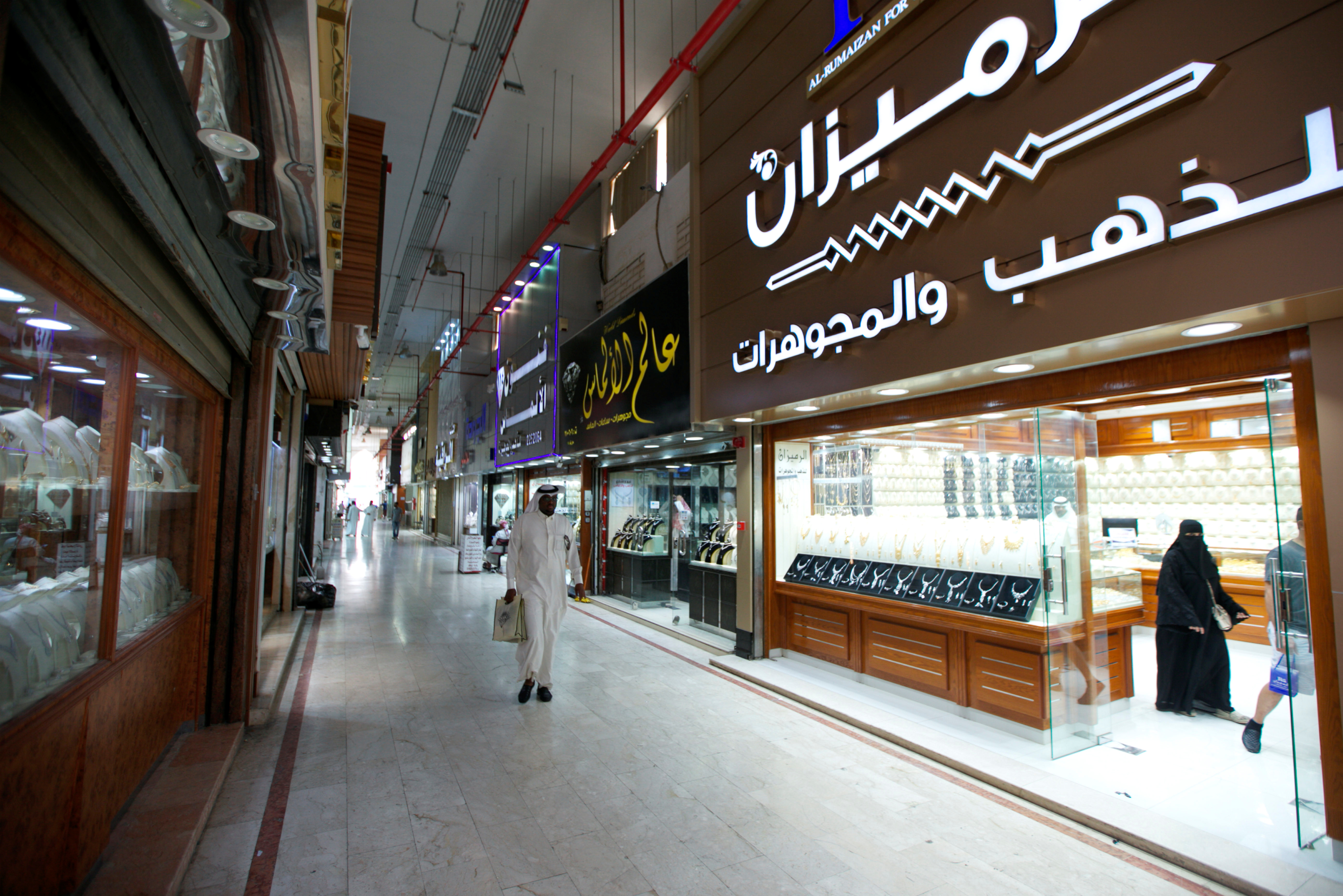 People walk inside a jewellery store in Riyadh
