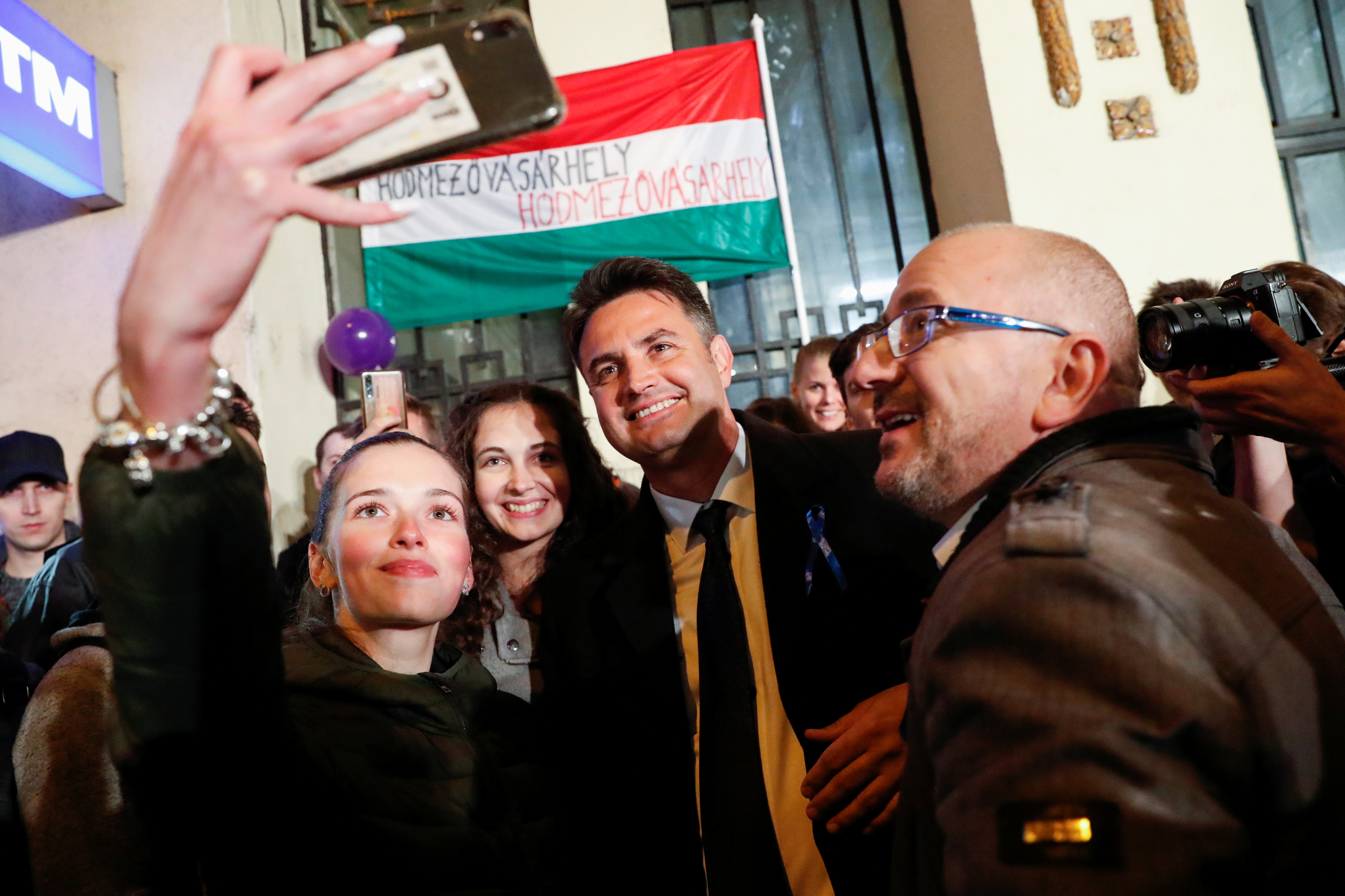 Opposition candidate for prime minister Peter Marki-Zay poses for a selfie with supporters at the election headquarters in Budapest