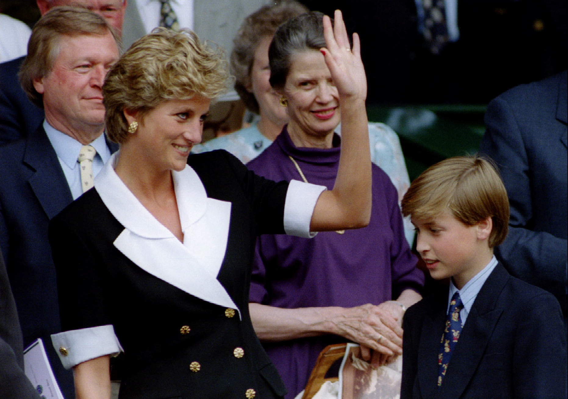 The Princess of Wales, accompanied by her son Prince William, arrives at Wimbledon's Centre Court before the start of the Women's Singles final July 2