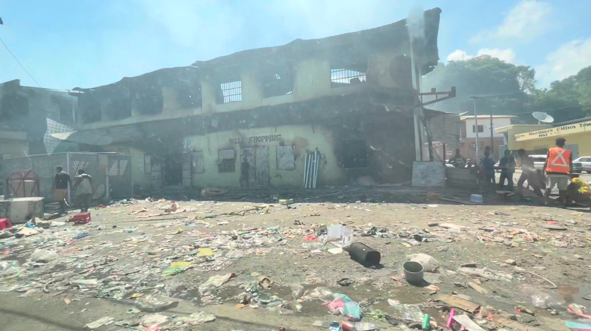 Destroyed building is depicted after days of unrest in Honiara, Solomon Islands on November 27, 2021 in this still image taken from a video.  Jone Tuiipelehaki / via REUTERS