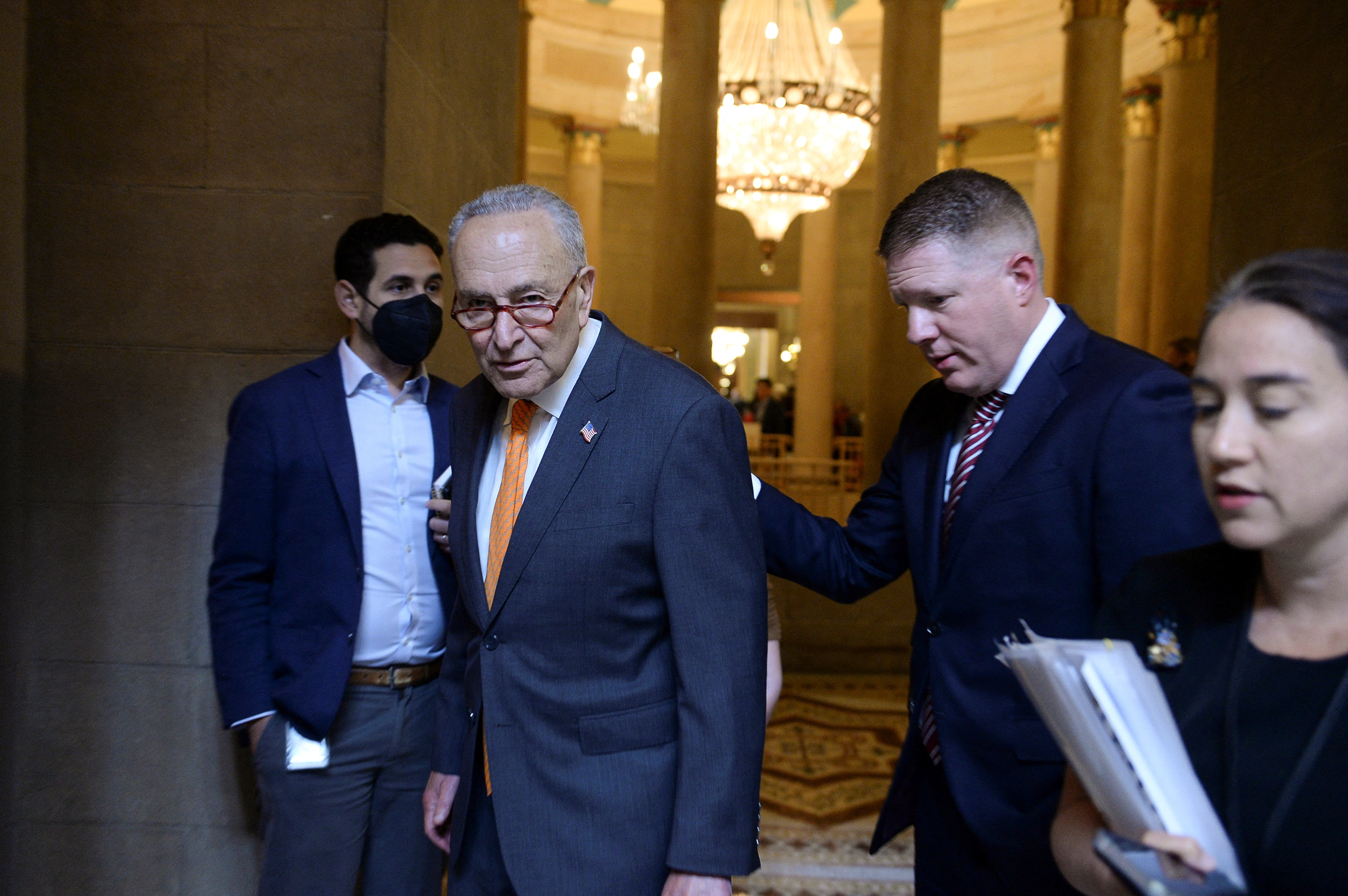 Senate Majority Leader Chuck Schumer (D-NY) walks with staff at the U.S. Capitol