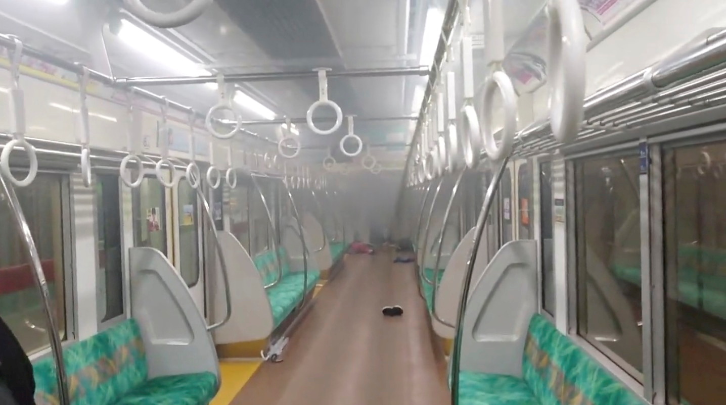Smoke is seen in a carriage of a Tokyo train line following a knife and arson attack in Japan October 31, 2021 in this still image obtained from a social media video. Twitter/@SIZ33 via REUTERS THIS IMAGE HAS BEEN SUPPLIED BY A THIRD PARTY. MANDATORY CREDIT. REFILE - CORRECTING TYPE OF ATTACK
