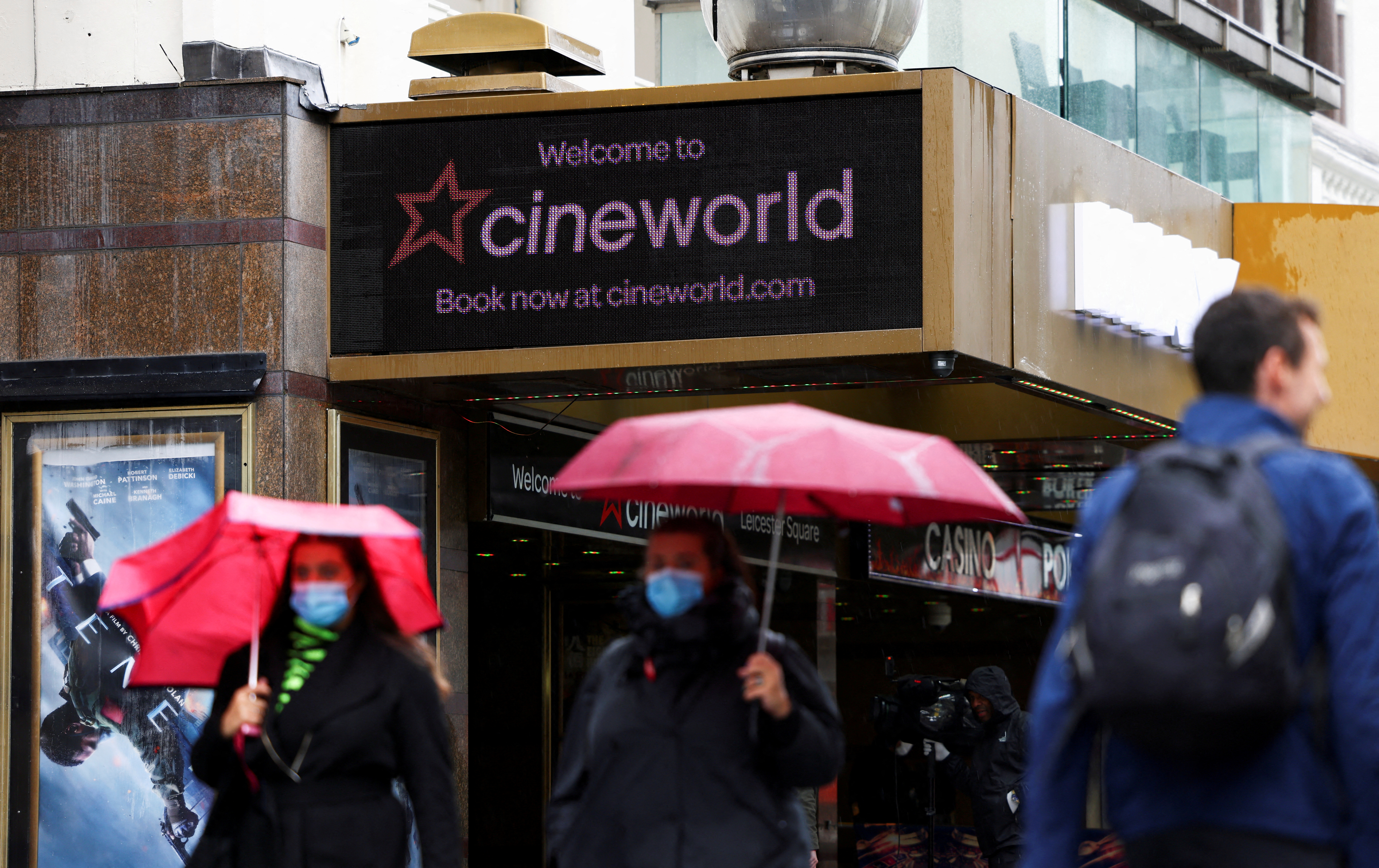 People walk past a Cineworld in Leicester's Square, amid the coronavirus disease (COVID-19) outbreak in London, Britain, October 4, 2020. REUTERS/Henry Nicholls