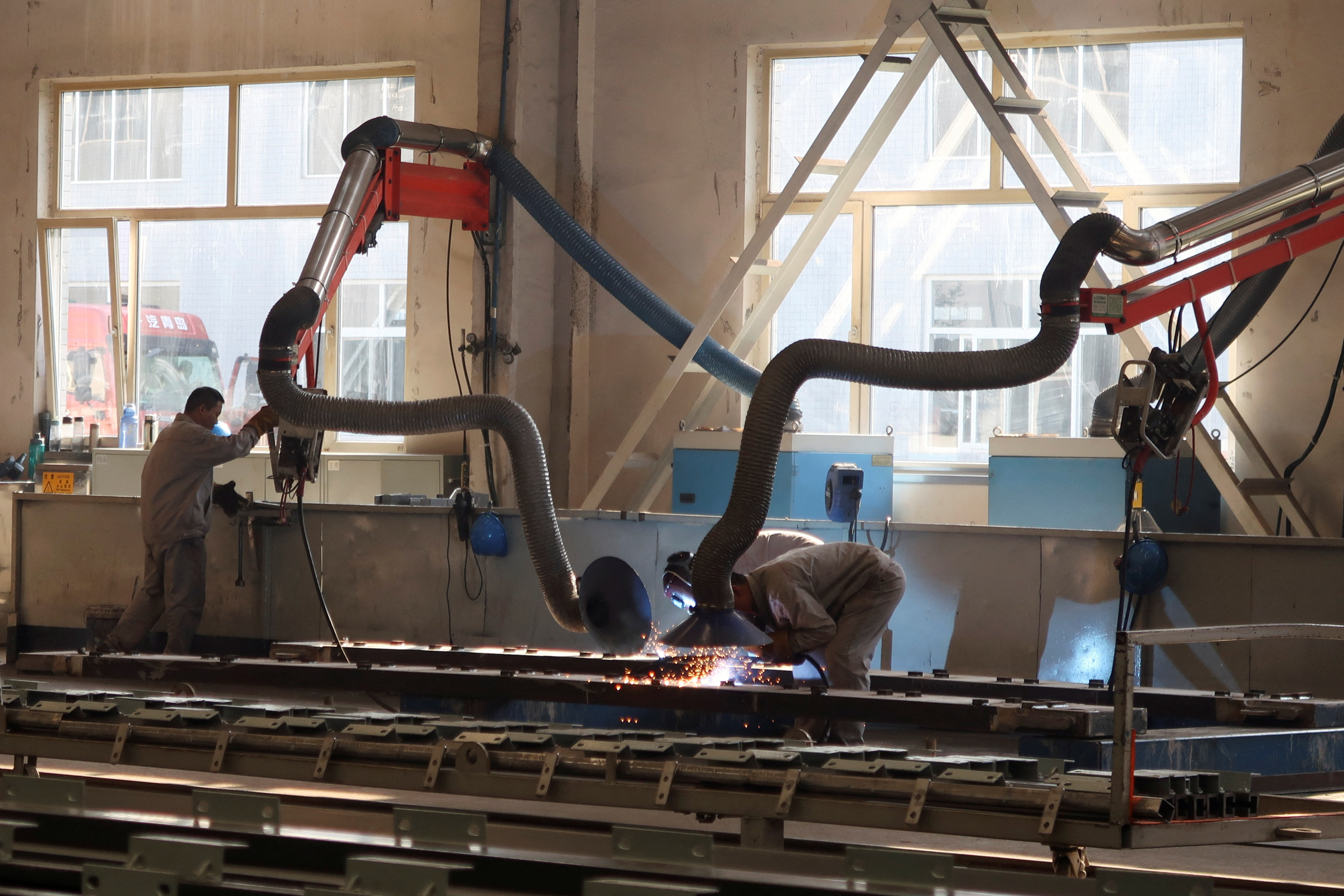 Employees work at Jingjin filter press factory in Dezhou