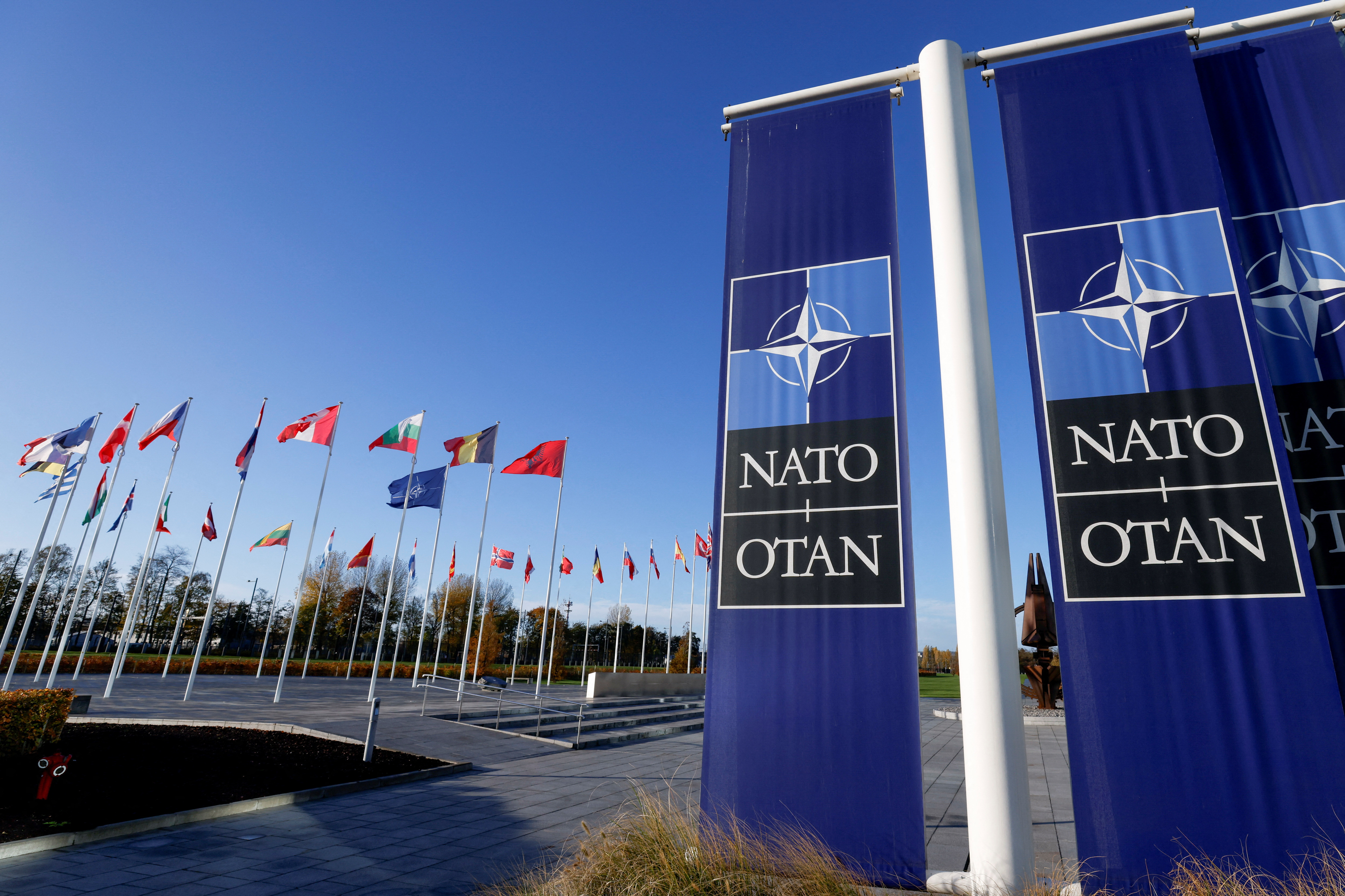 Flags fly outside NATO headquarters in Brussels