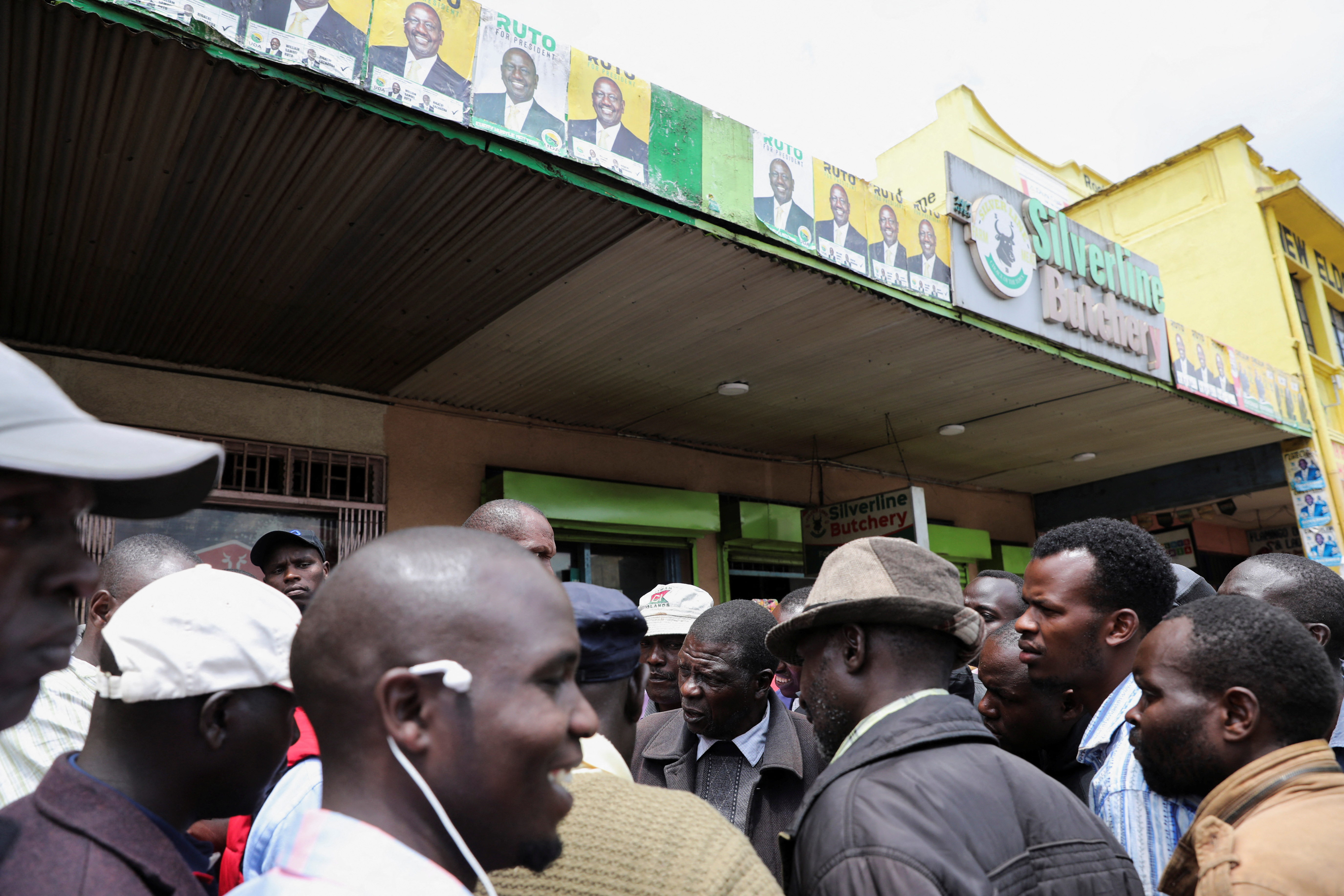 Kenyans wait for election results outside the Silverline Butchery restaurant in Eldoret