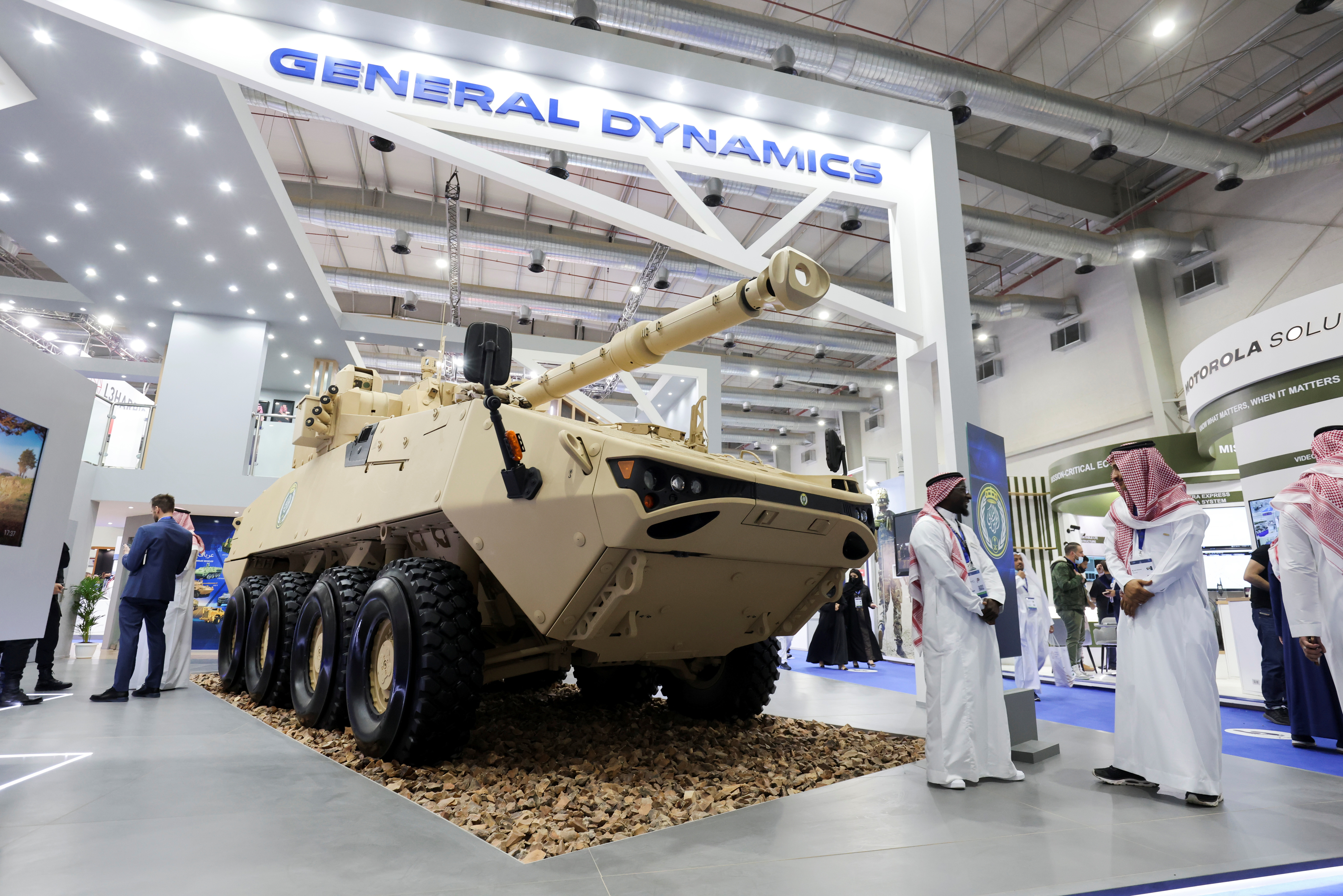 Saudi men are seen at General Dynamics stand displaying the latest defence system at World Defense Show in Riyadh, Saudi Arabia