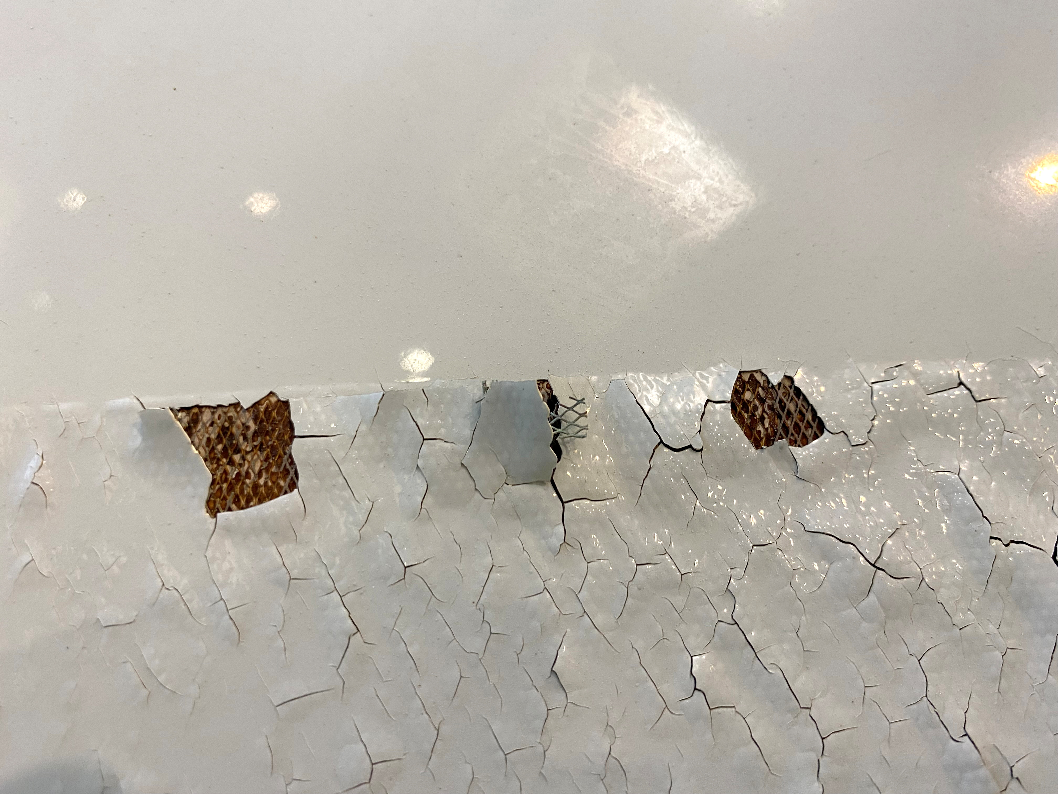 An undated image shows what appears to be paint peeling, cracking and exposed expanded copper foil (ECF) on the fuselage of a Qatar Airways A350 aircraft grounded by the Qatari regulator. Image obtained by Reuters.