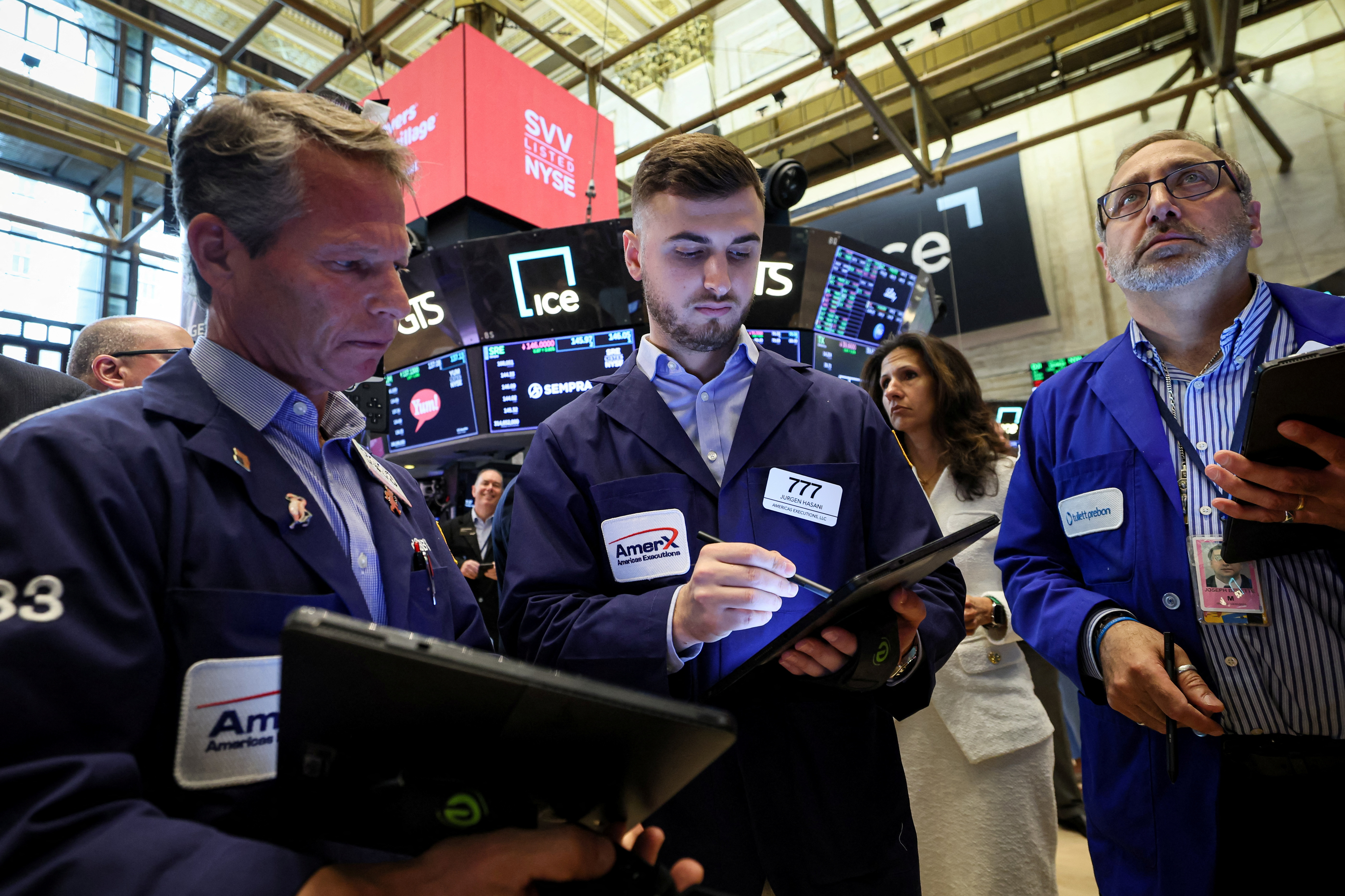 Traders work on the floor of the NYSE in New York