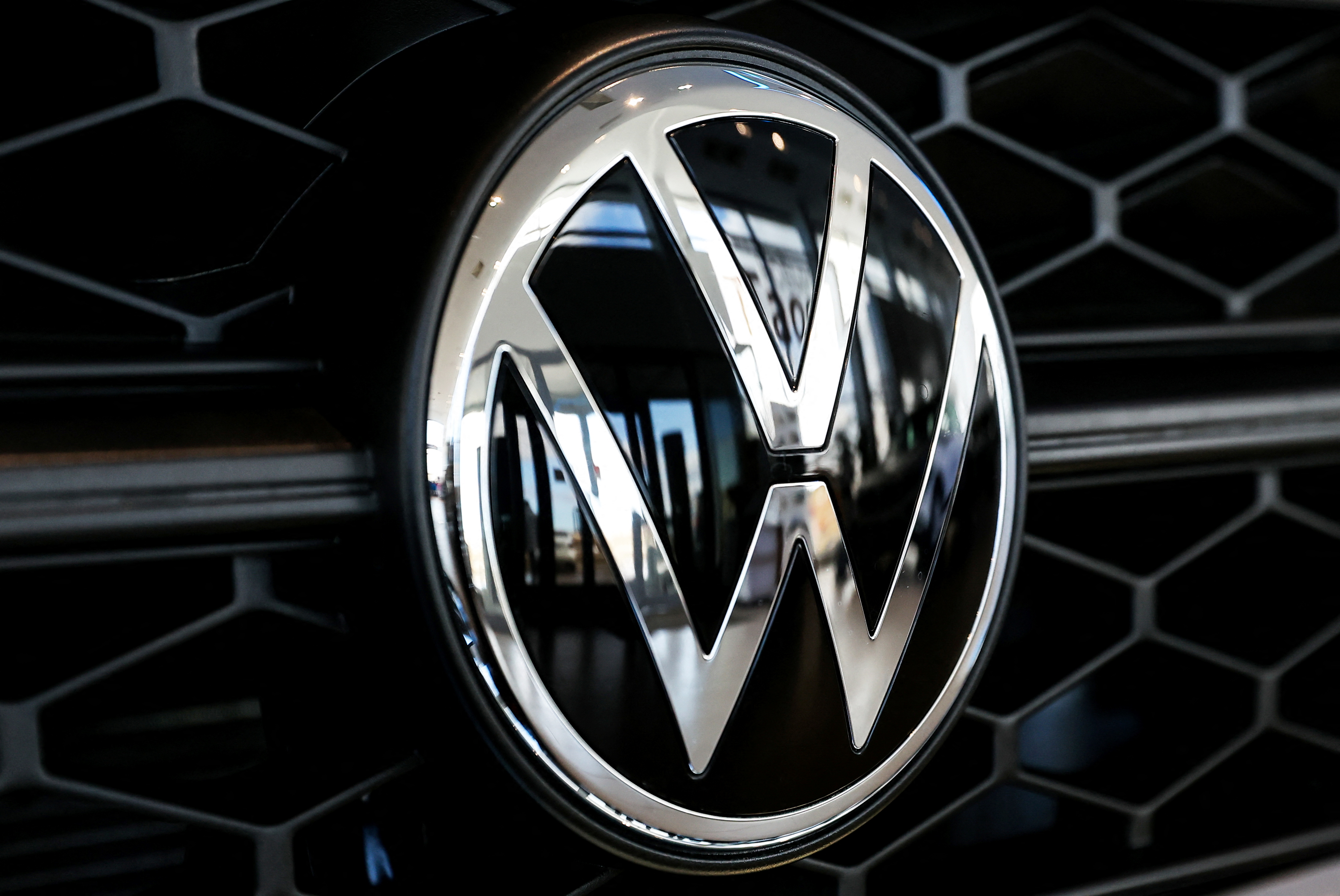 A VW badge is seen on a car at a dealership in Kaluga