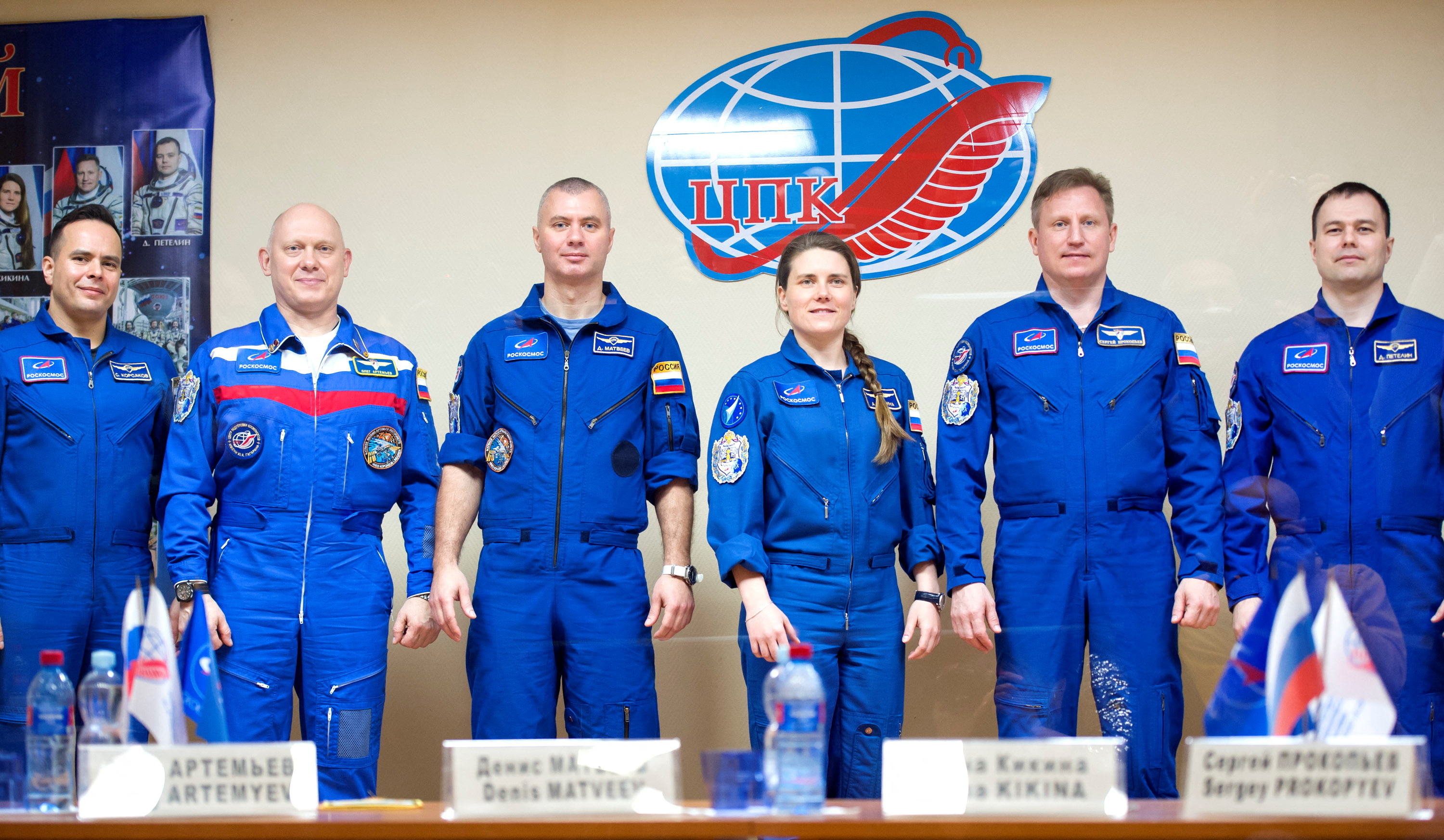 Crew members and backup crew members attend a news conference ahead of the expedition to the International Space Station at the Baikonur Cosmodrome