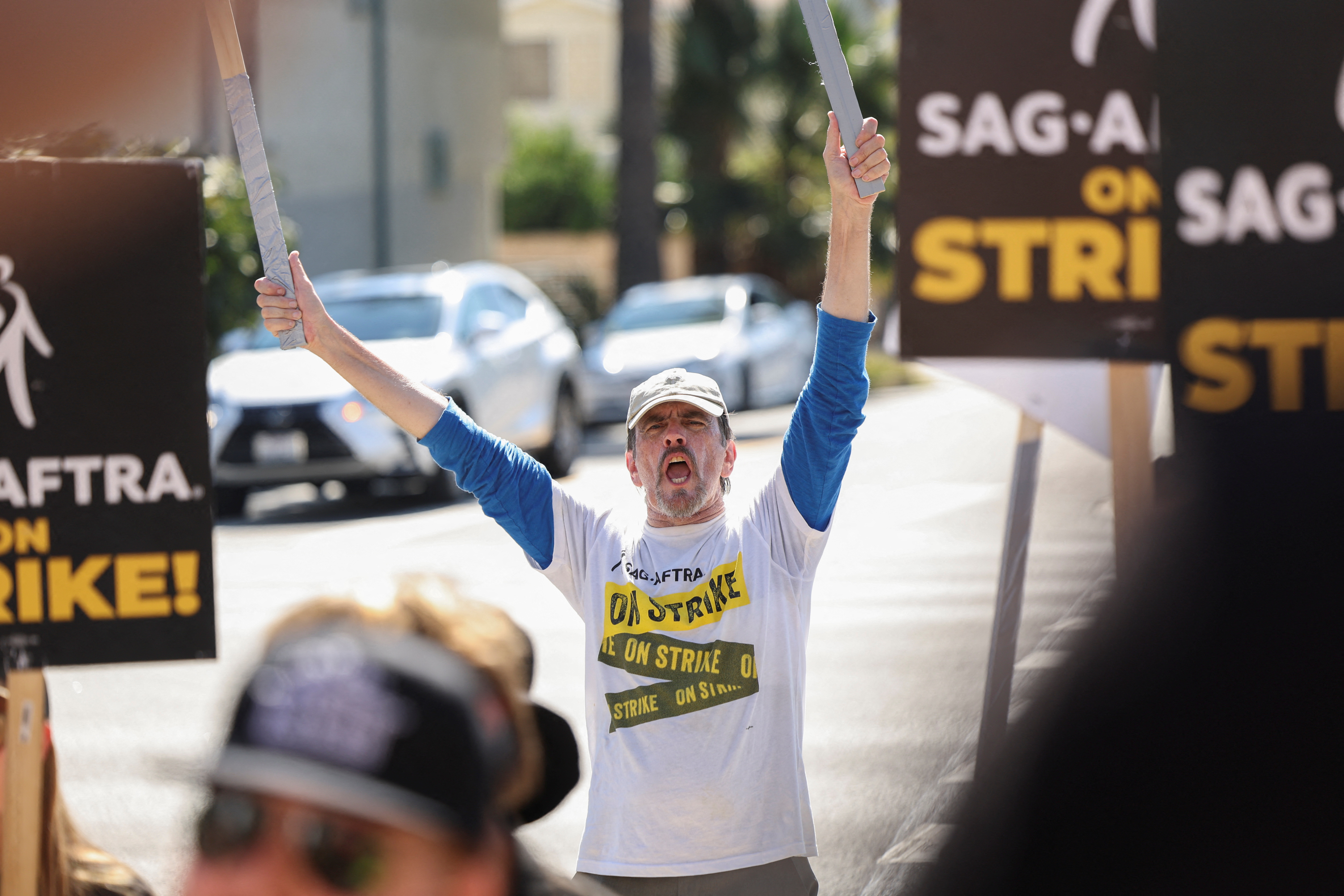 SAG-AFTRA members walk the picket line during their ongoing strike, in Los Angeles