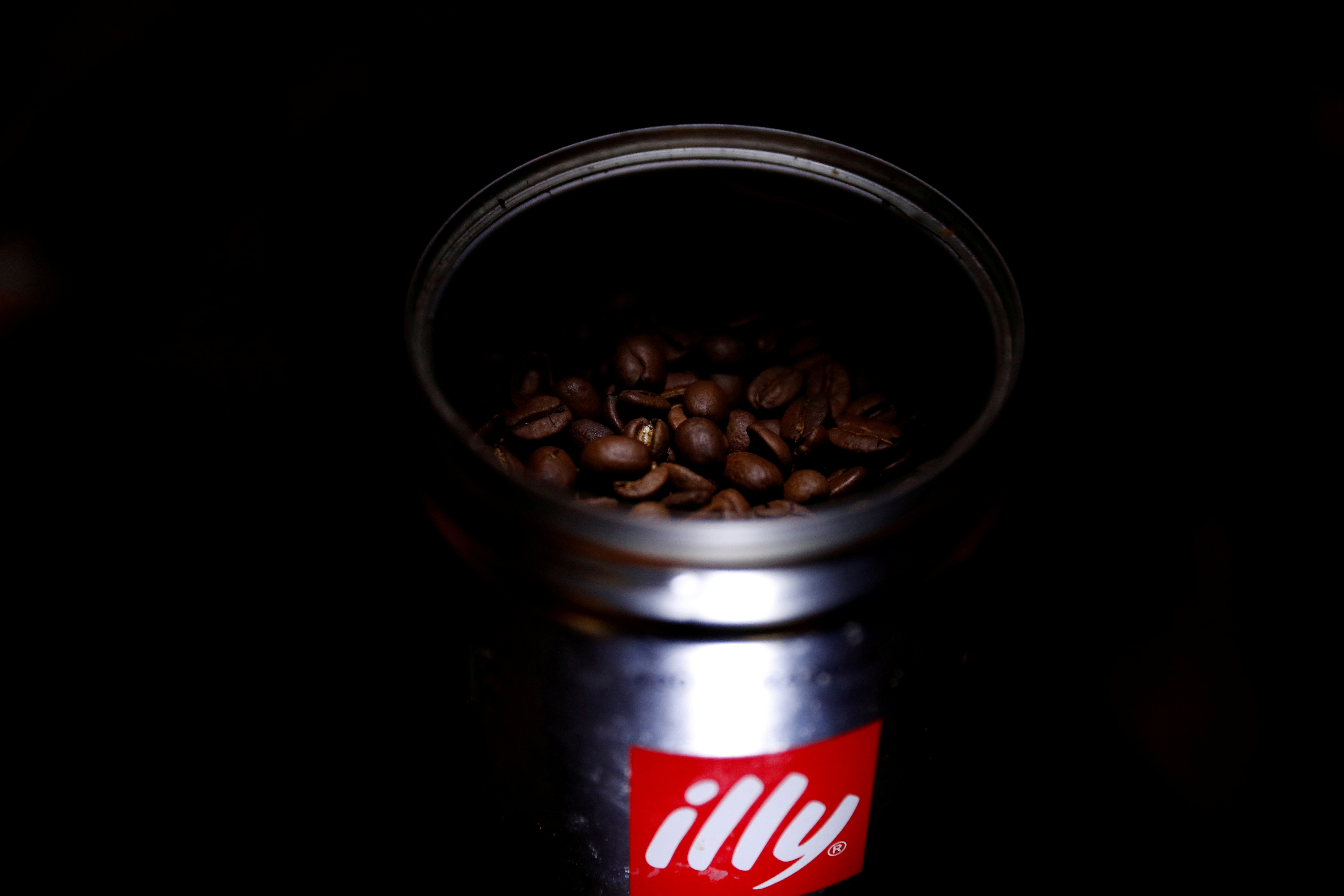 Coffee beans are seen inside a tin of Illy coffee in Manchester