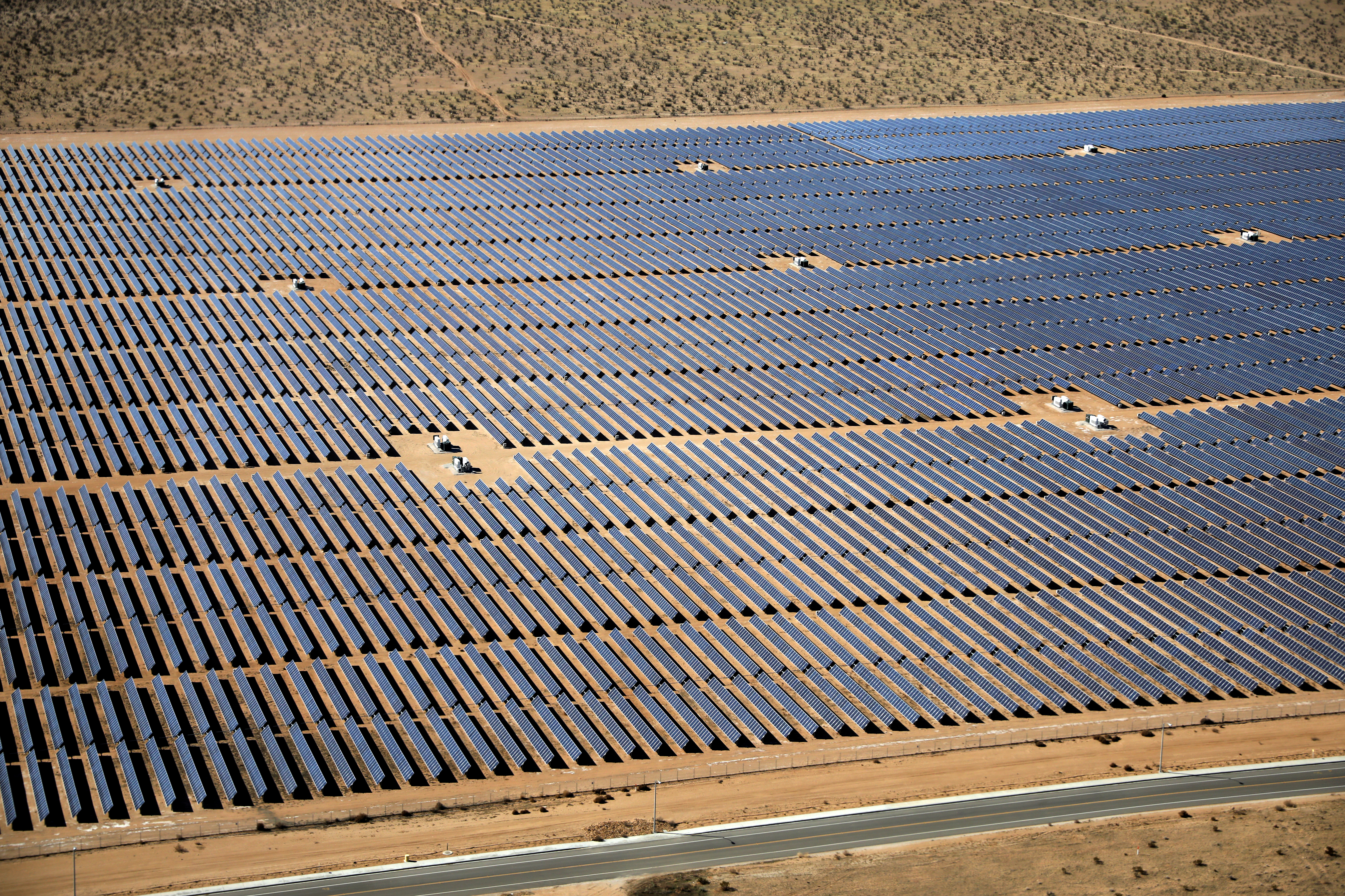 An array of solar panels is seen in the desert near Victorville