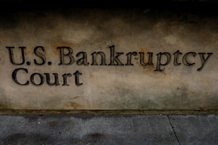A woman enters the U.S. District Bankruptcy Court in the Southern District of New York in New York