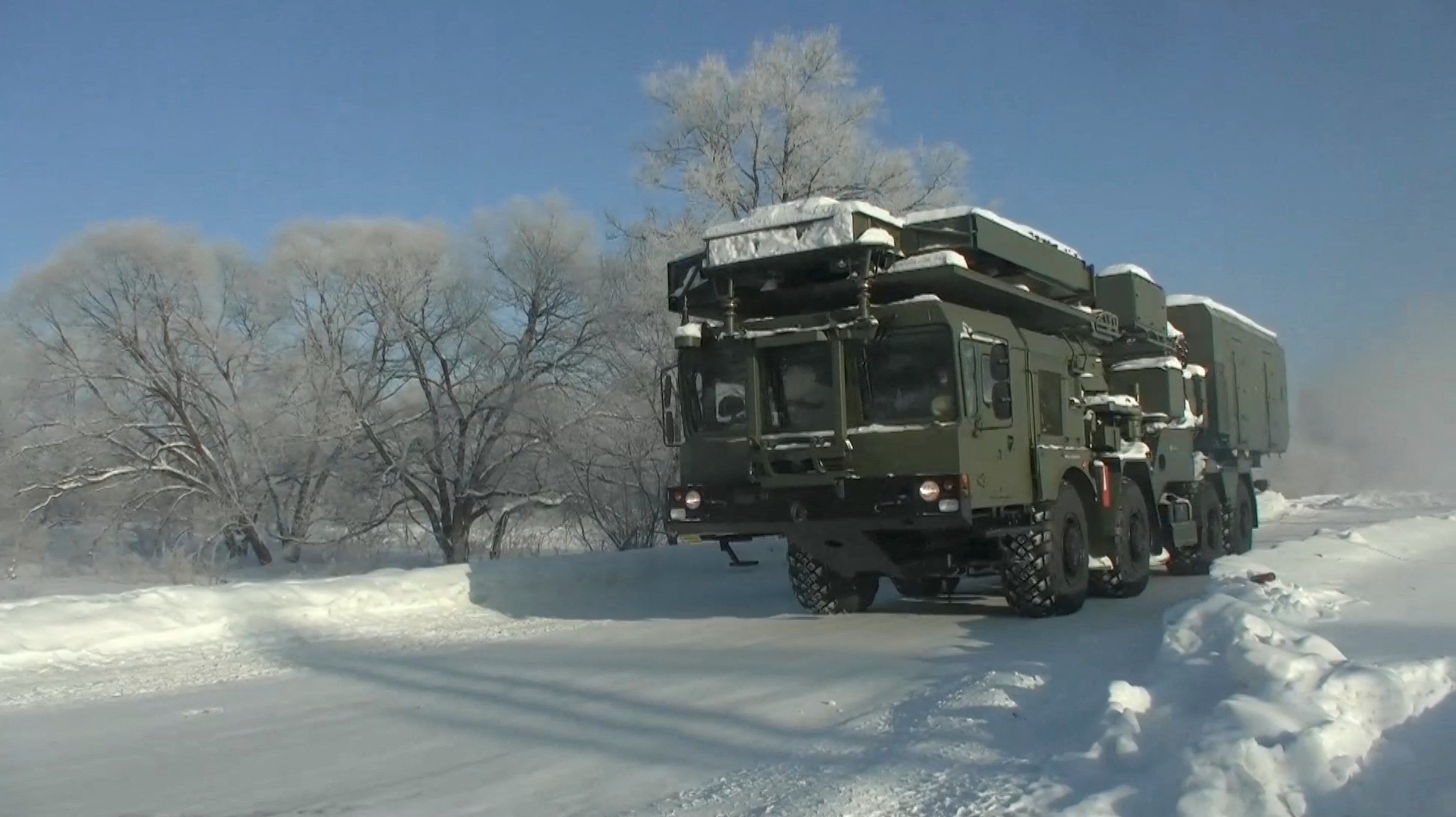 A radar vehicle of the S-400 Triumph surface-to-air missile system drives along a road on the way to Belarus to join military drills, in Khabarovsk region, Russia, in this still image taken from video released January 21, 2022. Russian Defence Ministry/Handout via REUTERS