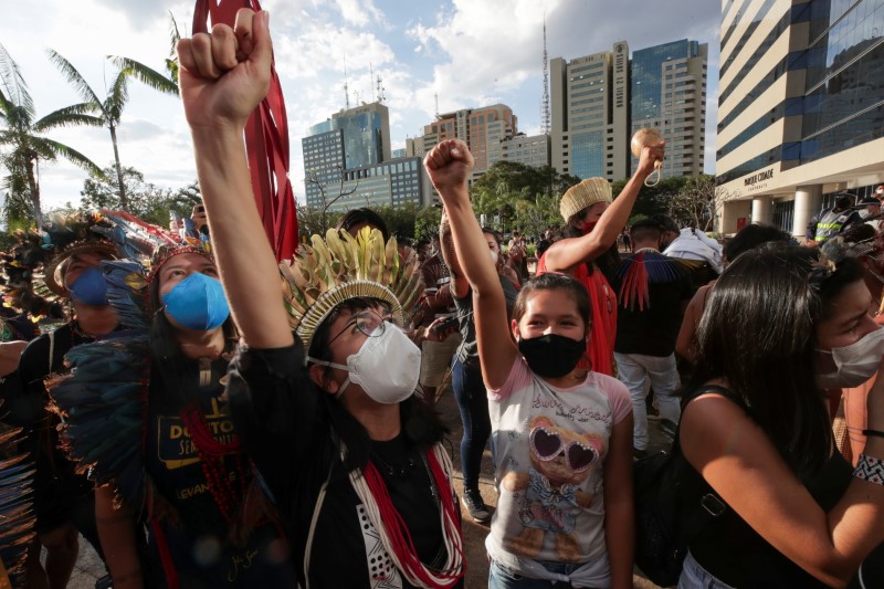 Indigenous Brazilians take part in a protest to defend the demarcation of indigenous lands, in Brasilia
