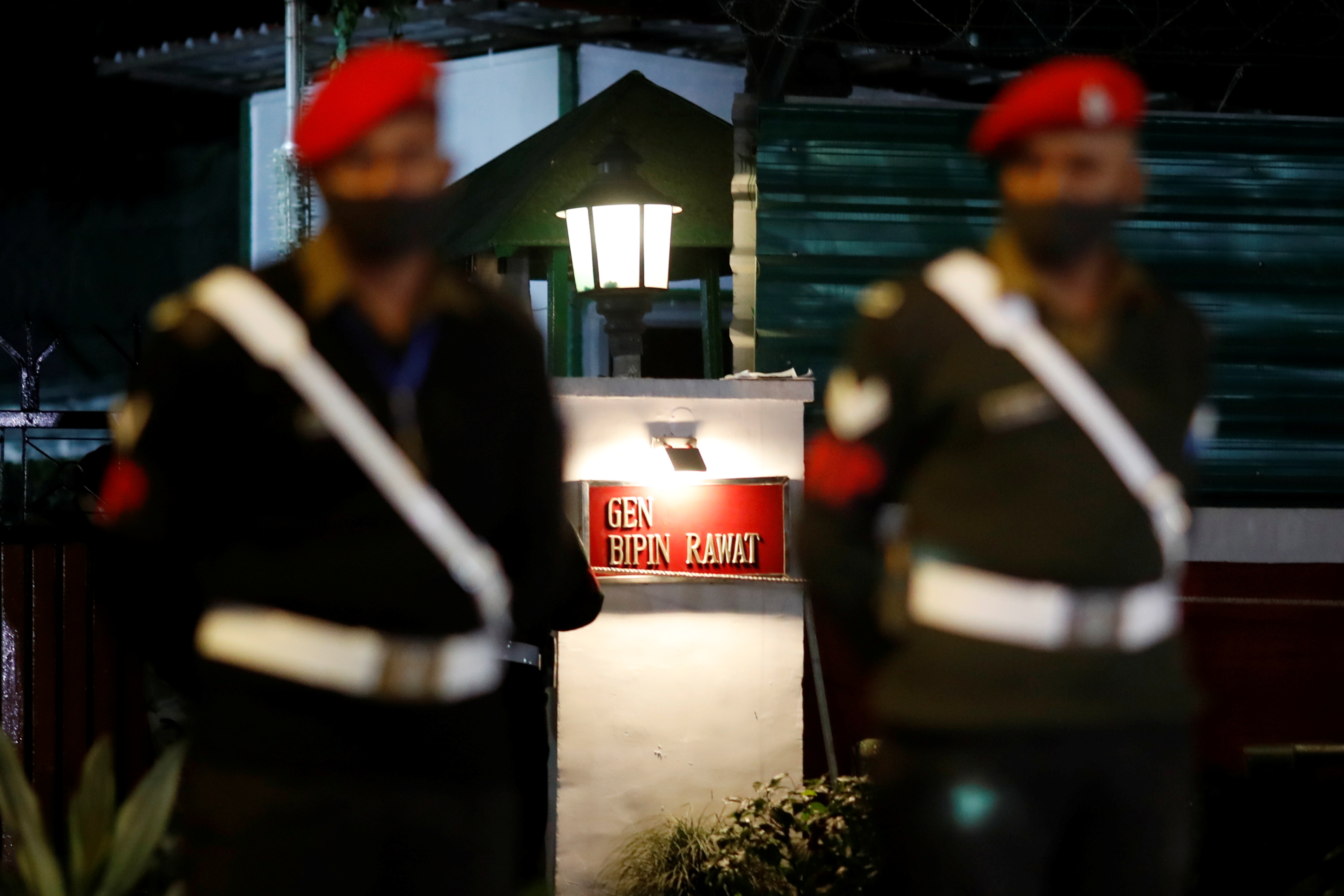 Army personnel stand outside the residence of India's Chief of Defence Staff General Bipin Rawat, after the military helicopter that transported him crashed in southern India, in New Delhi, India, December 8, 2021. REUTERS/Adnan Abidi