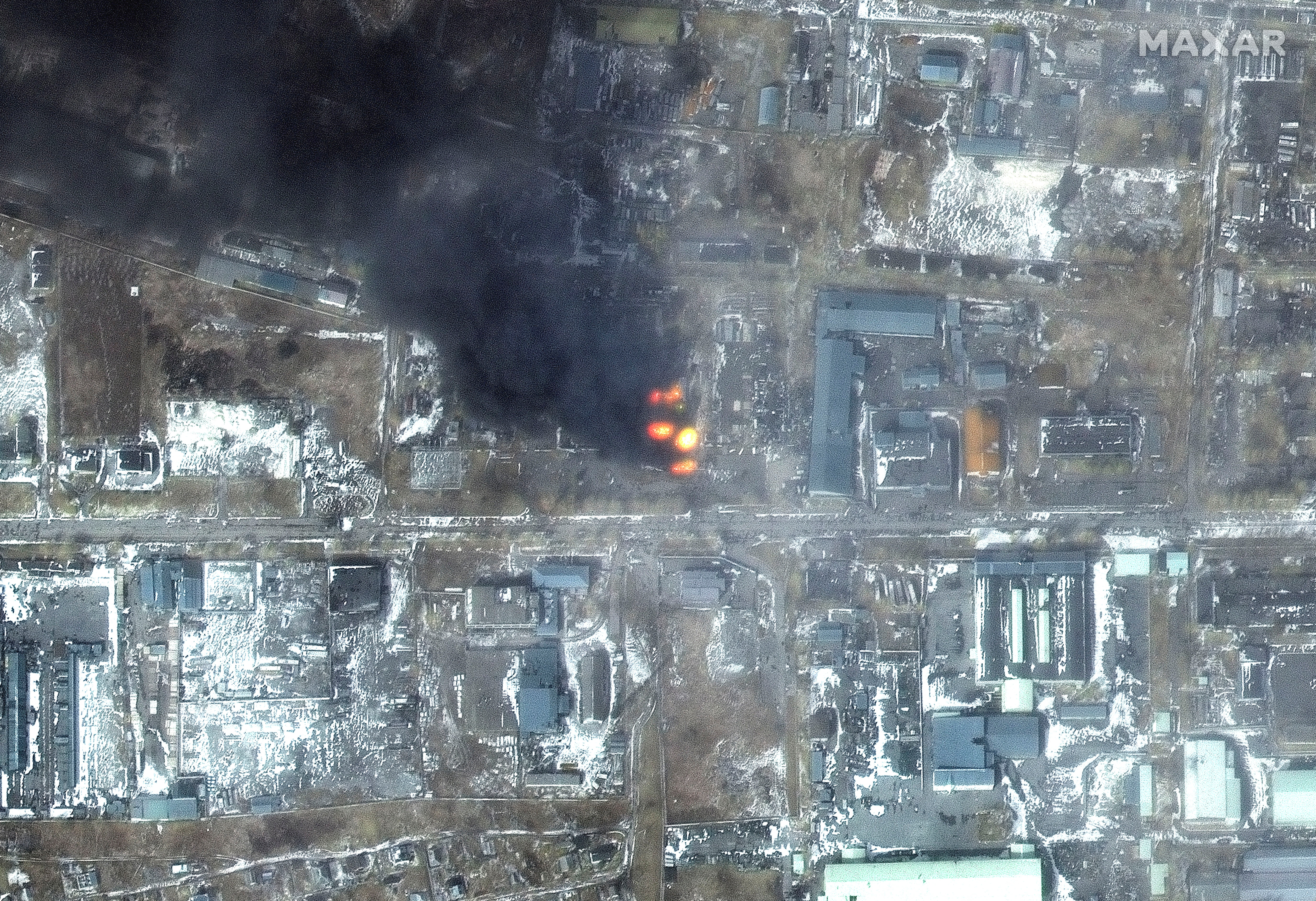 A satellite image shows a multispectral view of fires in an industrial area, in the western section of Mariupol