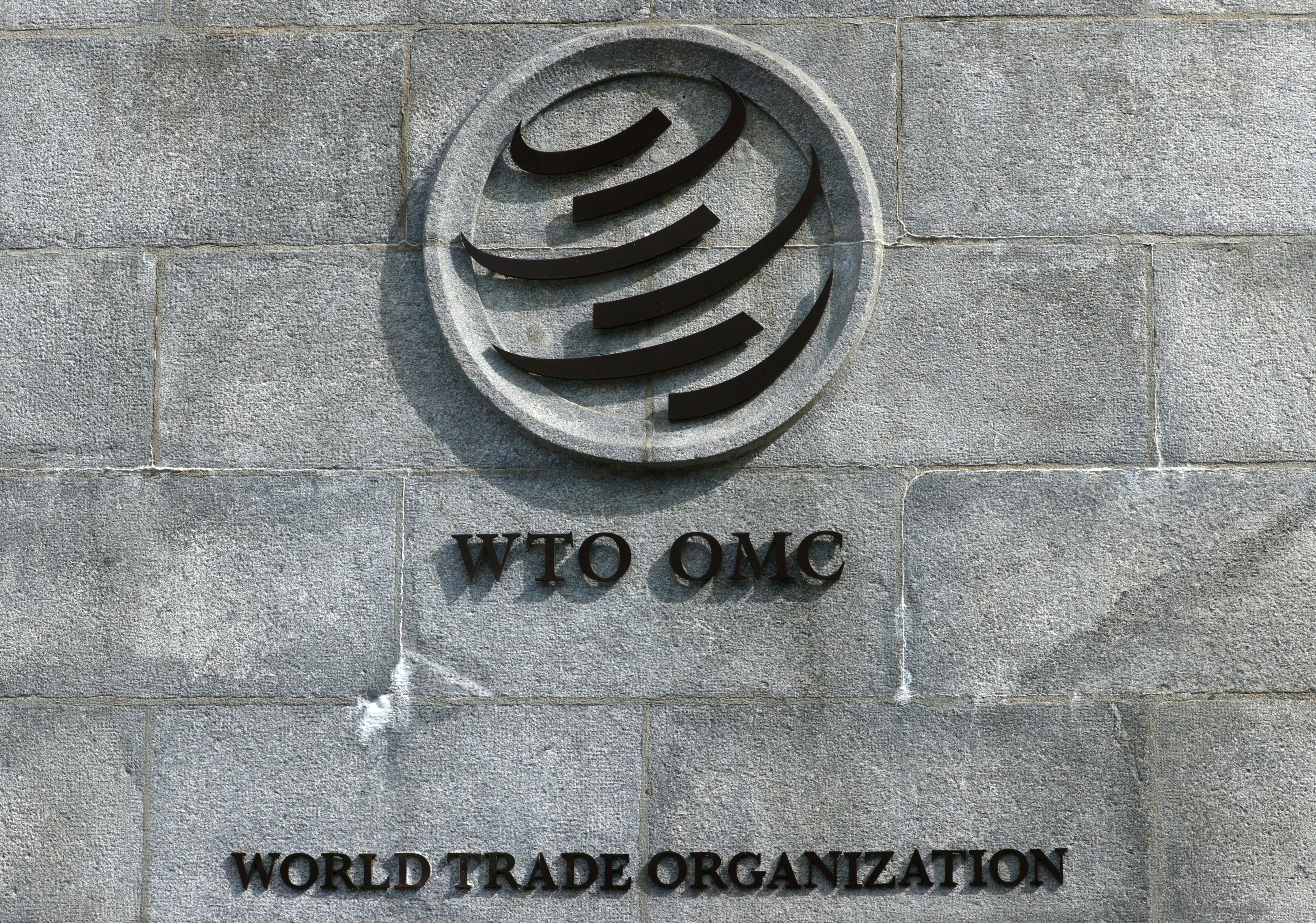 A logo is pictured outside the World Trade Organisation (WTO) in Geneva, Switzerland, September 28, 2021. REUTERS/Denis Balibouse/File Photo