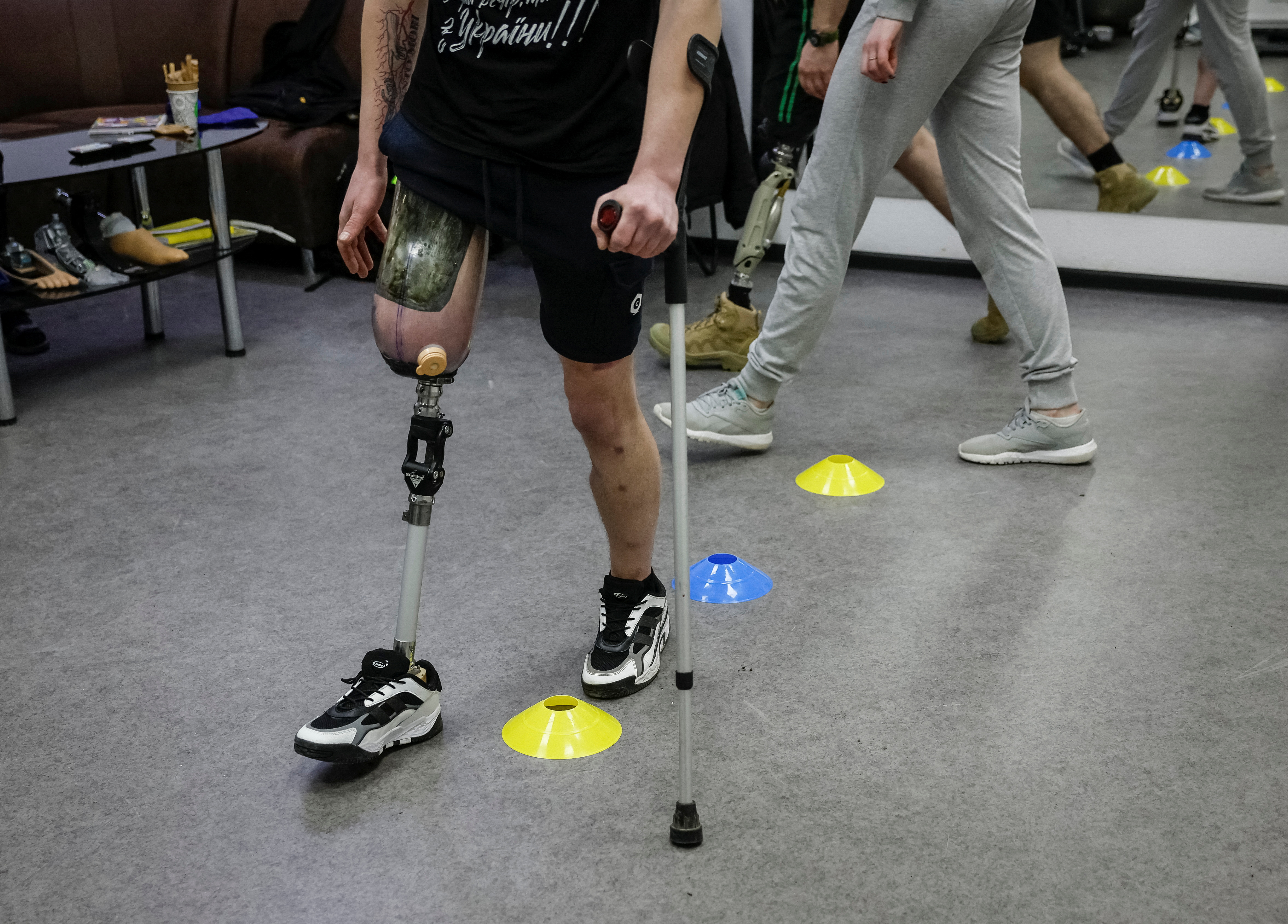Dmytro Zilko, a soldier and a patient of the clinic exercises on a new prosthesis in the prosthetics clinic in Kyiv