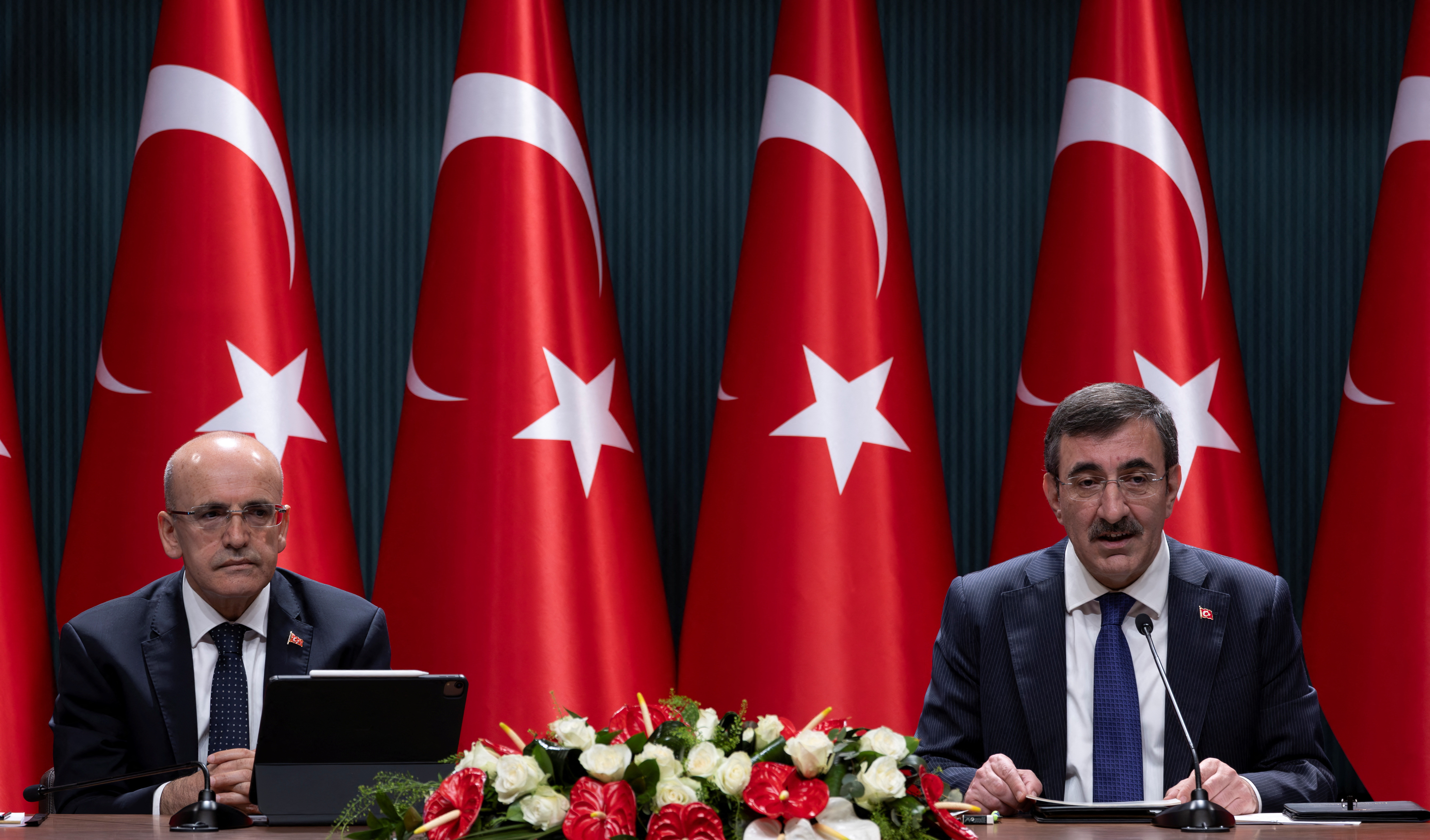 Turkey's Vice President Cevdet Yilmaz and Finance Minister Mehmet Simsek attend a press conference in Ankara