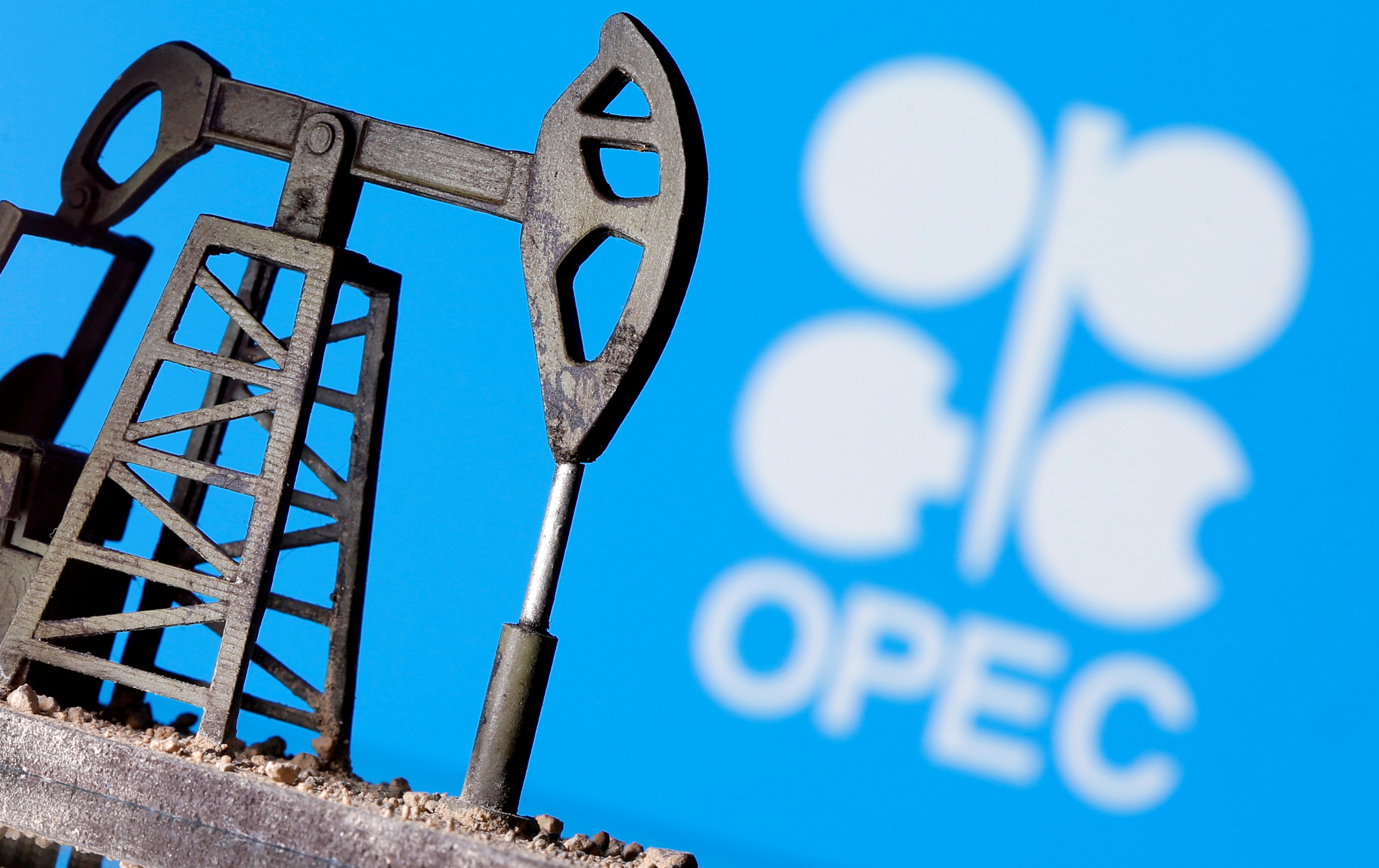 A 3D printed oil pump jack is seen in front of displayed OPEC logo in this illustration picture, April 14, 2020. REUTERS/Dado Ruvic/Illustration/File Photo