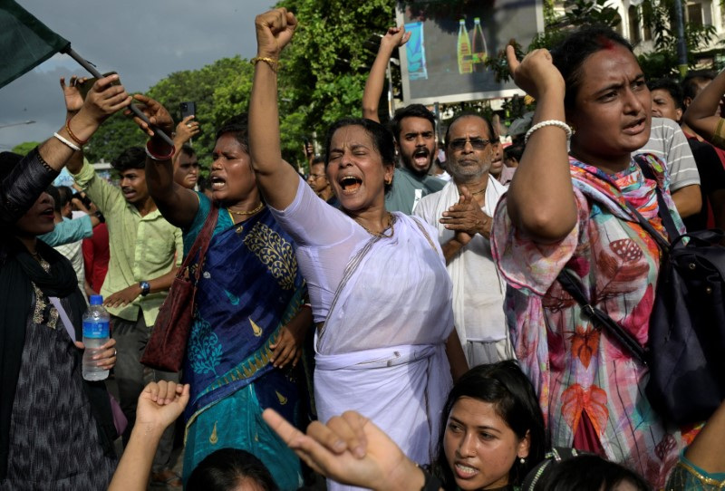 Demonstrators shout slogans during a protest against what they say is violence against Hindu communities during ongoing unrest, in Dhaka