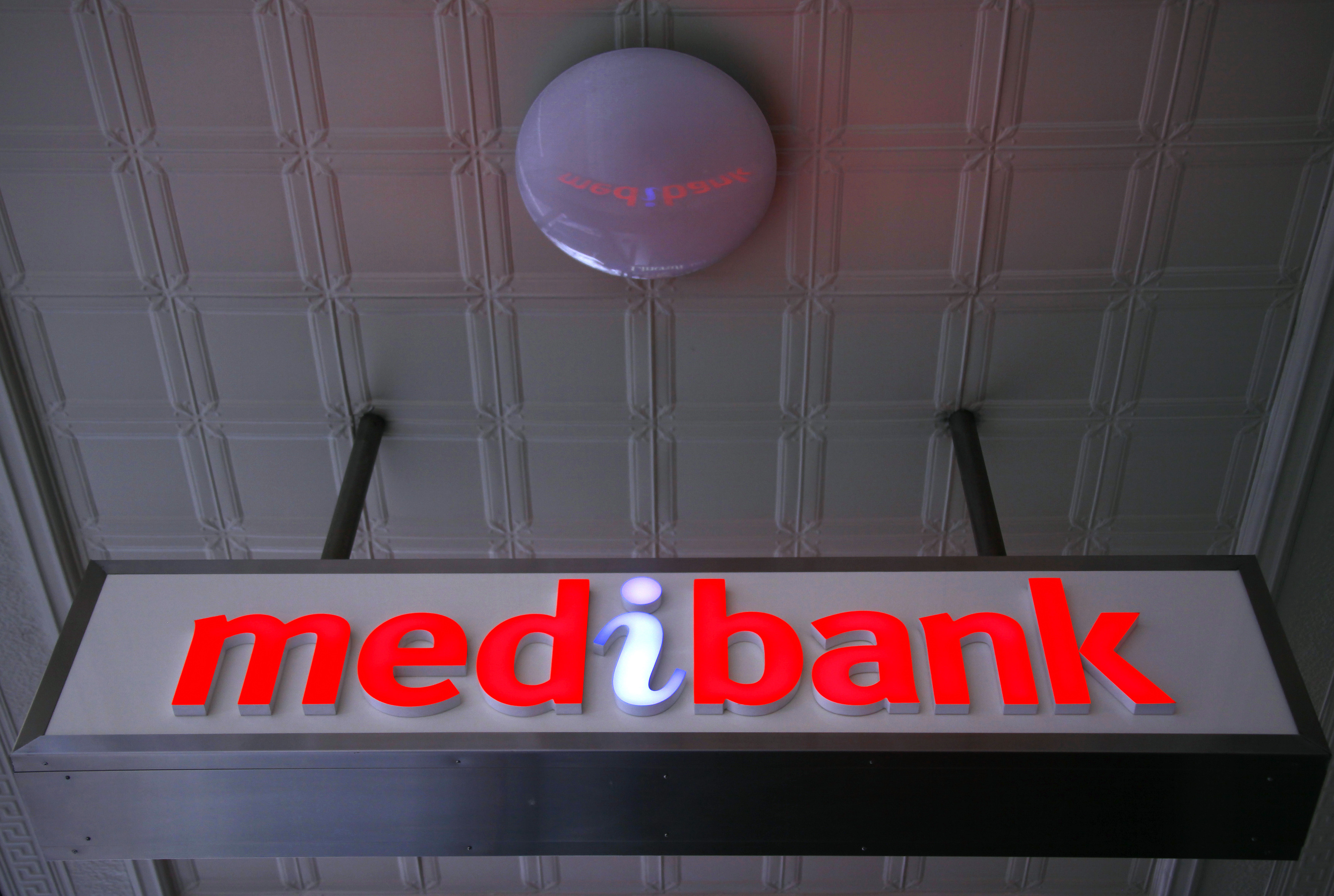 An illuminated sign is seen outside a branch of the Australian health insurer Medibank Private in Sydney