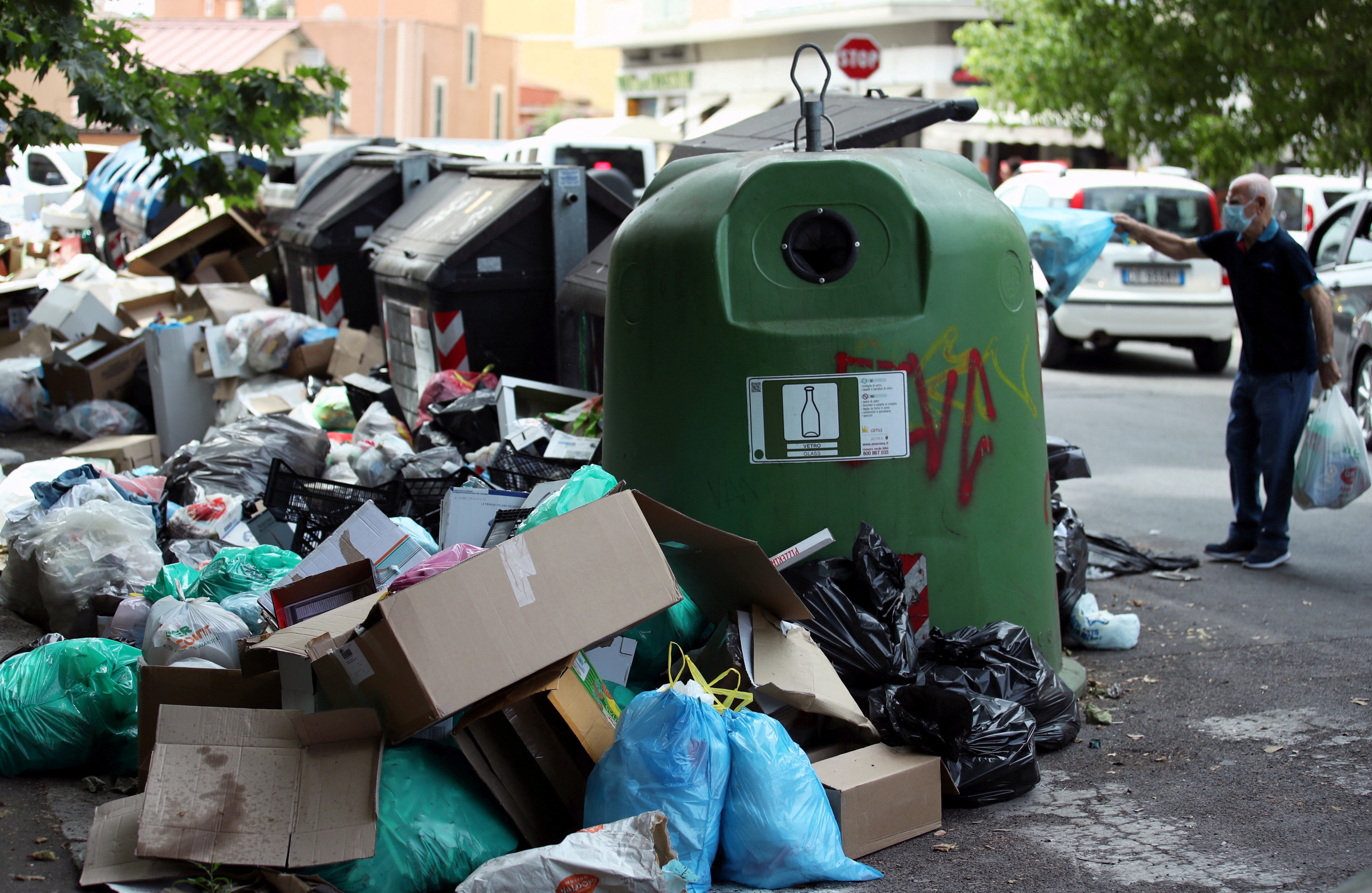 Rubbish mounts up around garbage containers as Rome authorities struggle to provide a regular disposal service
