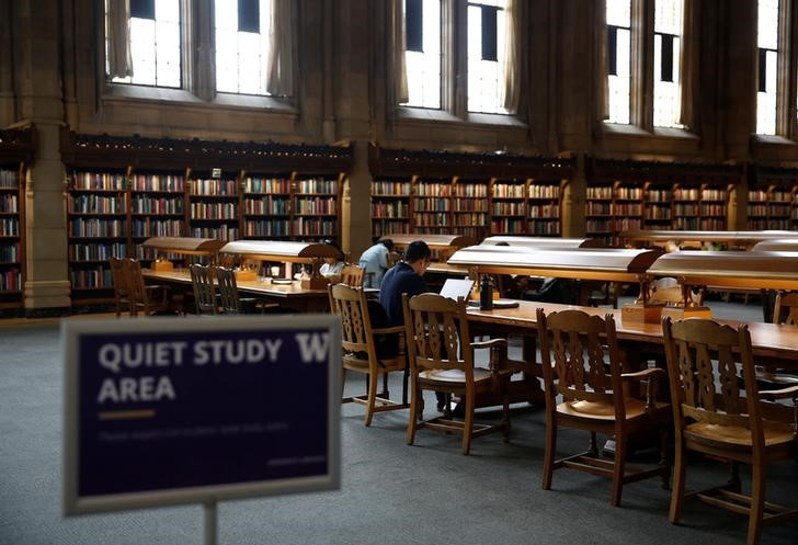 Students study in the Reading Room at Suzzallo Library at the University of Washington in Seattle Washington