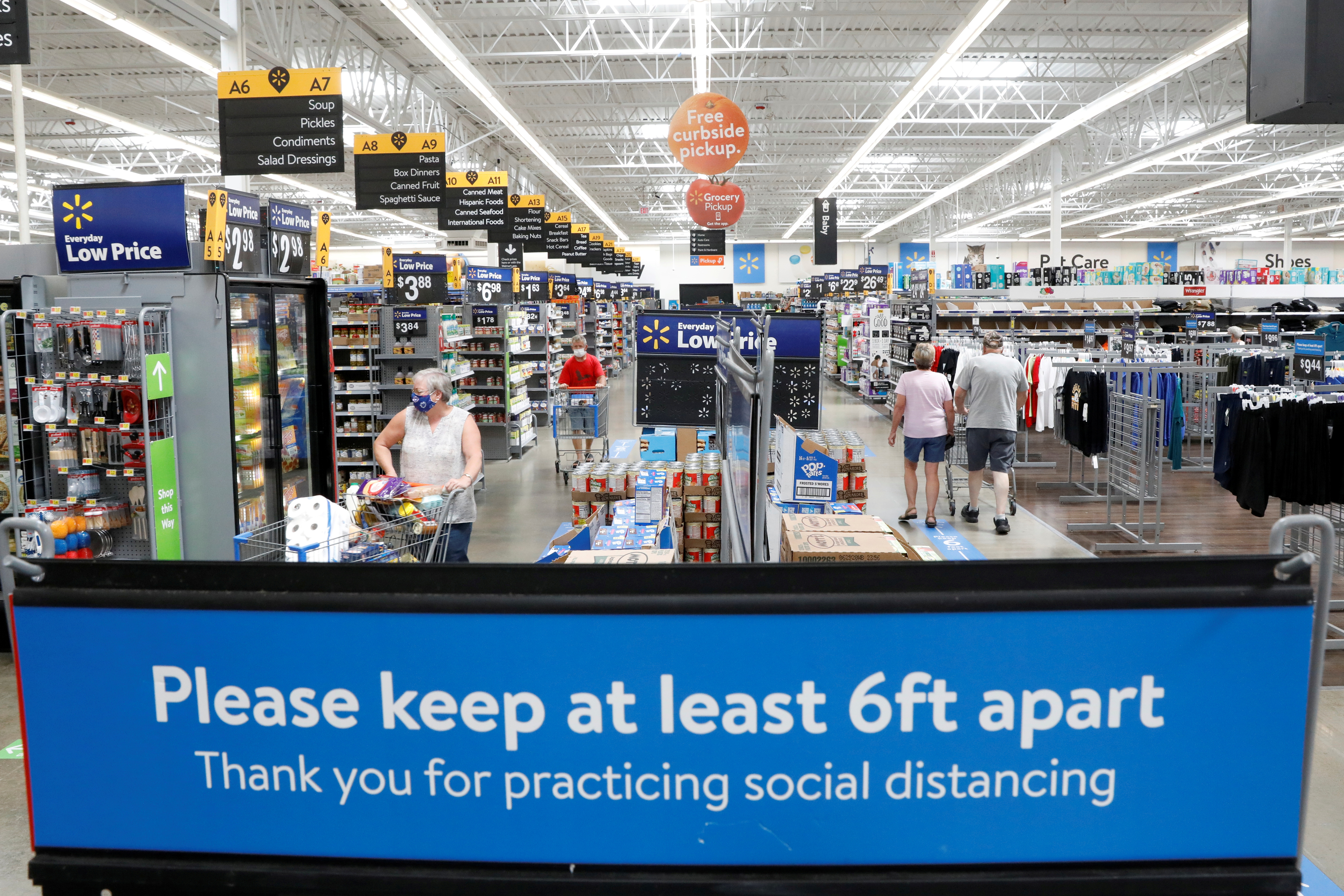 Shoppers are seen wearing masks while shopping at a Walmart store in Bradford, Pennsylvania