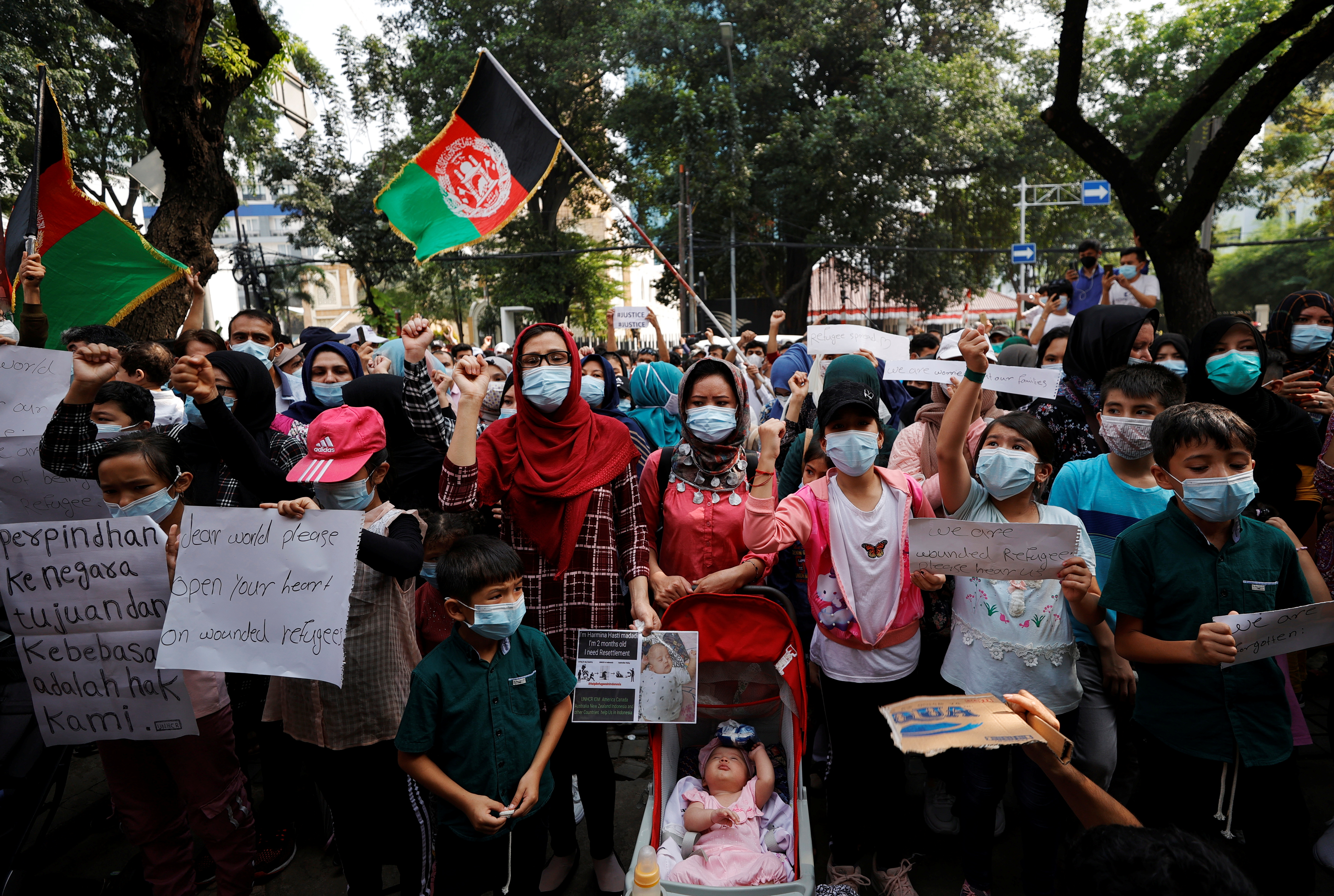 Afghan refugees in Indonesia protest outside the UN Refugee Agency UNHCR's office in Jakarta