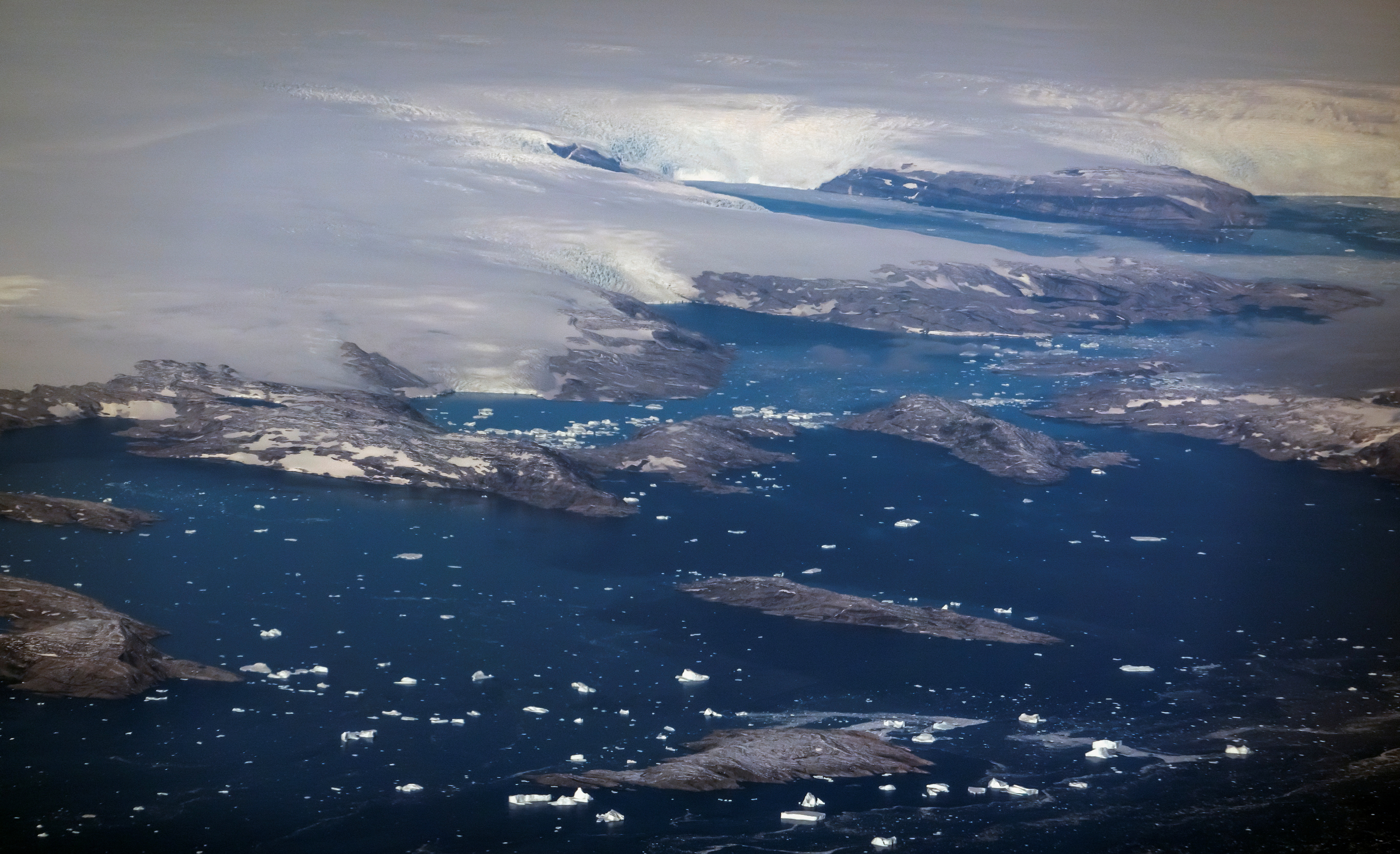 Icebergs and the edge of the ice sheed are seen at the west coast close to Tasiilaq