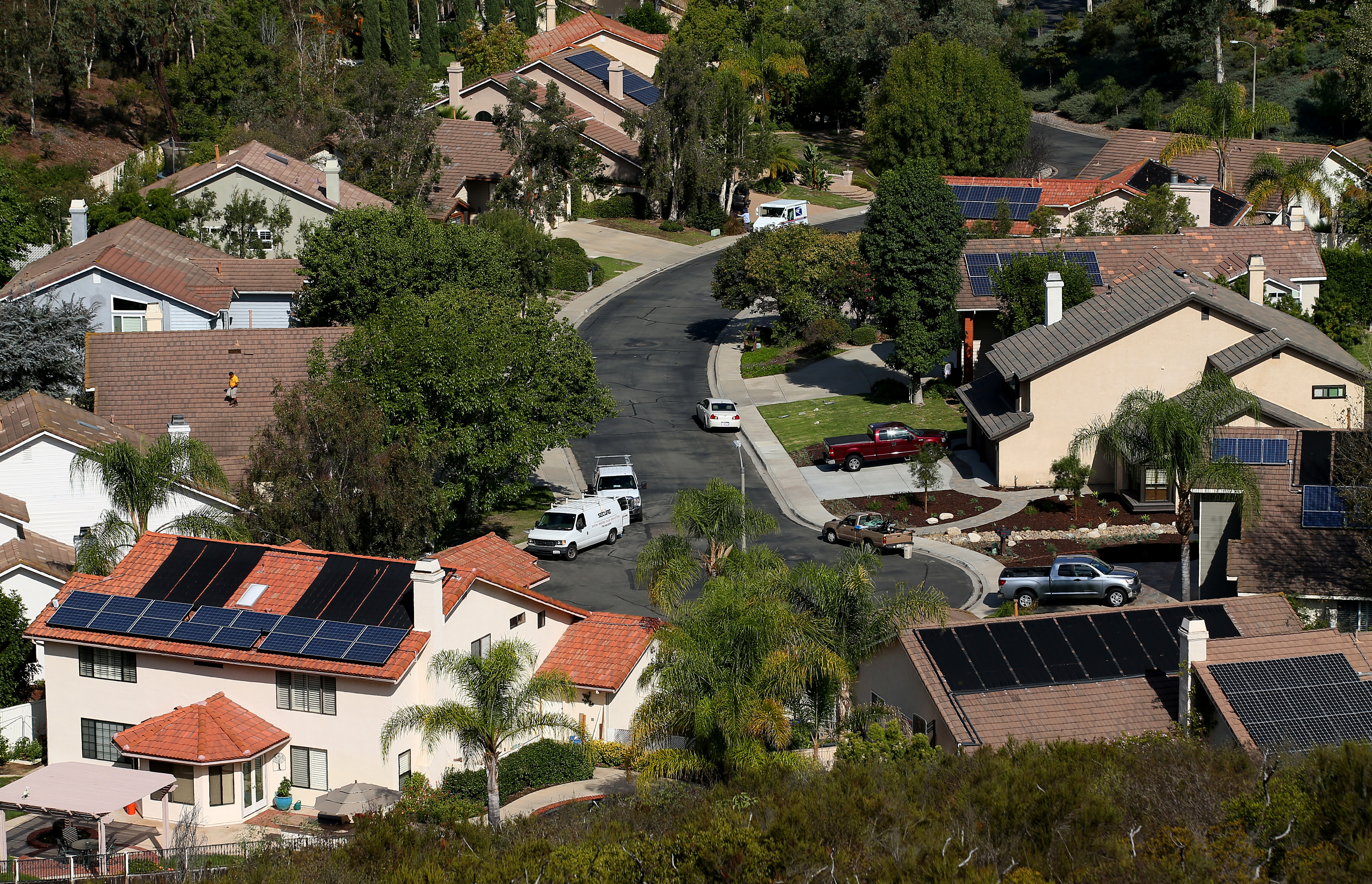 Multiple homes with solar panels are shown in Scripps Ranch, San Diego, California