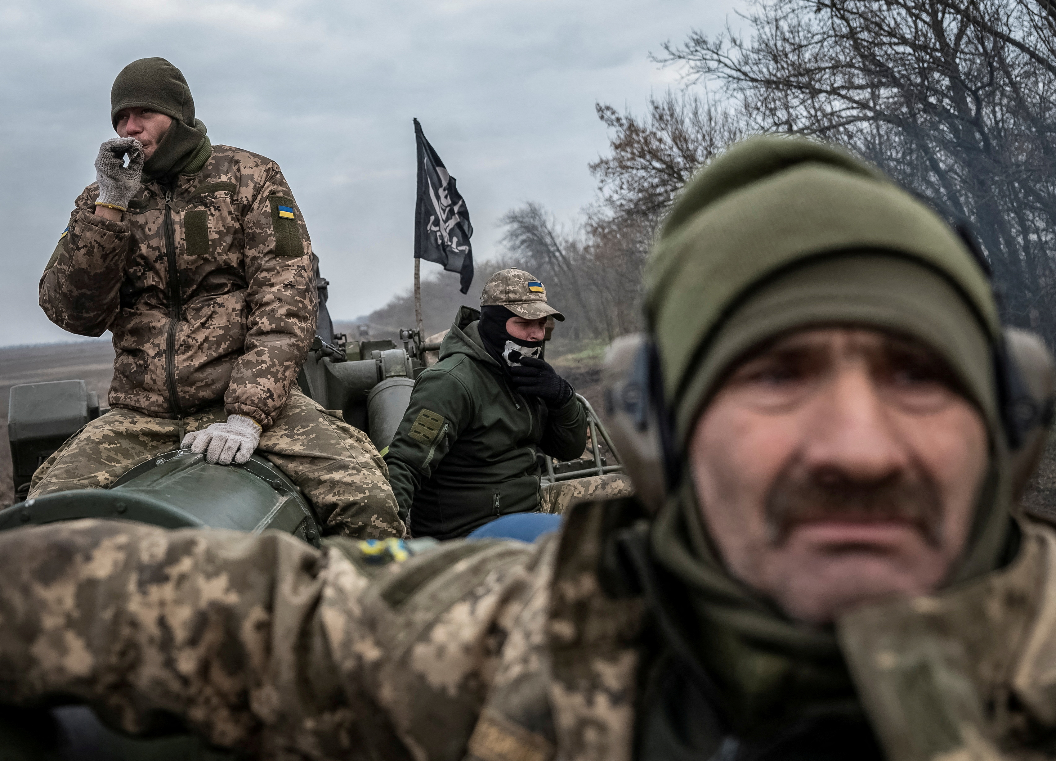 Ukrainian servicemen ride a 2S7 Pion self-propelled gun near a frontline in Kherson region