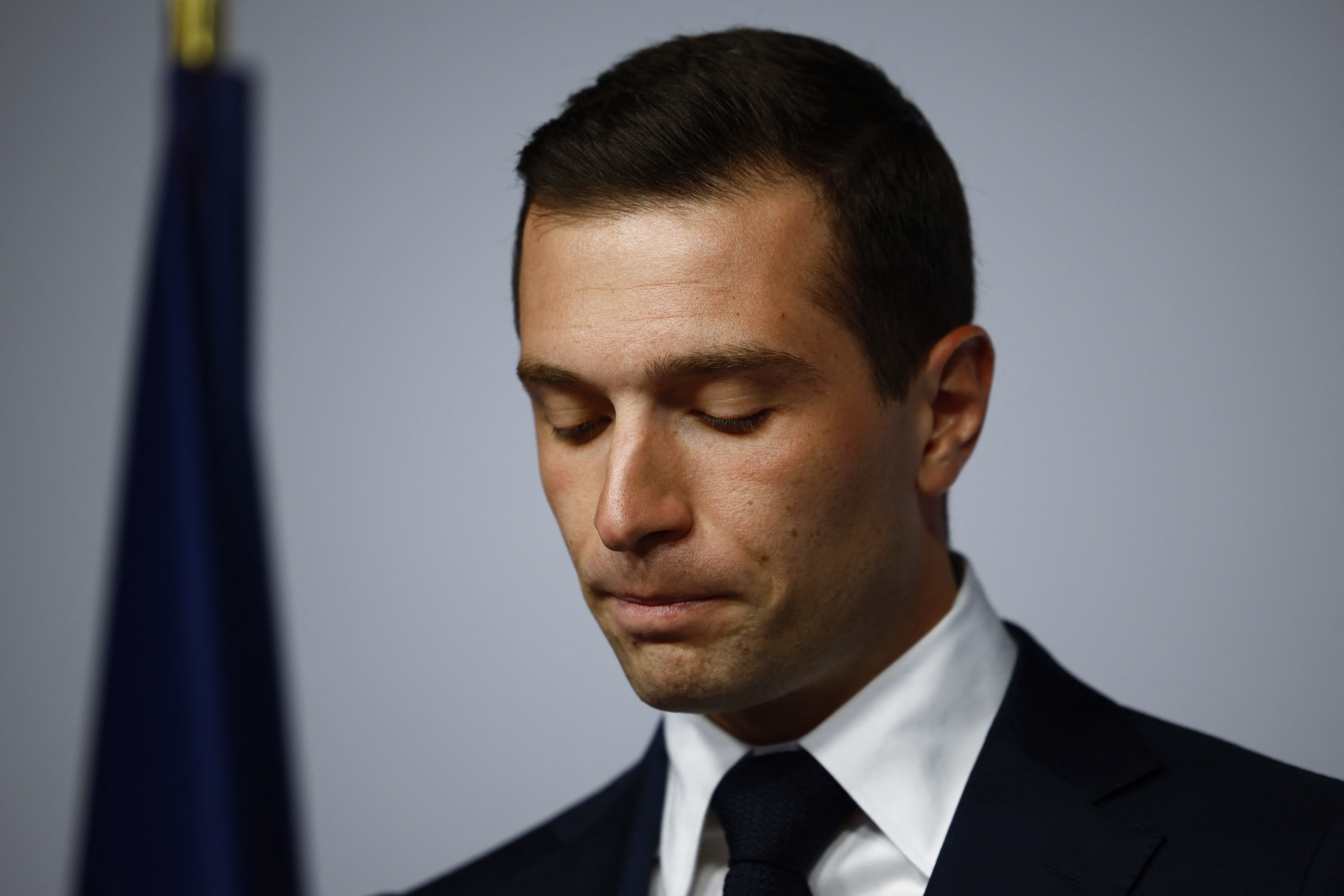 Jordan Bardella, President of the French far-right Rassemblement National (National Rally - RN) party, react on stage after partial results in the second round of the early French parliamentary elections in Paris, France, July 7, 2024. REUTERS/Sarah Meyssonnier 