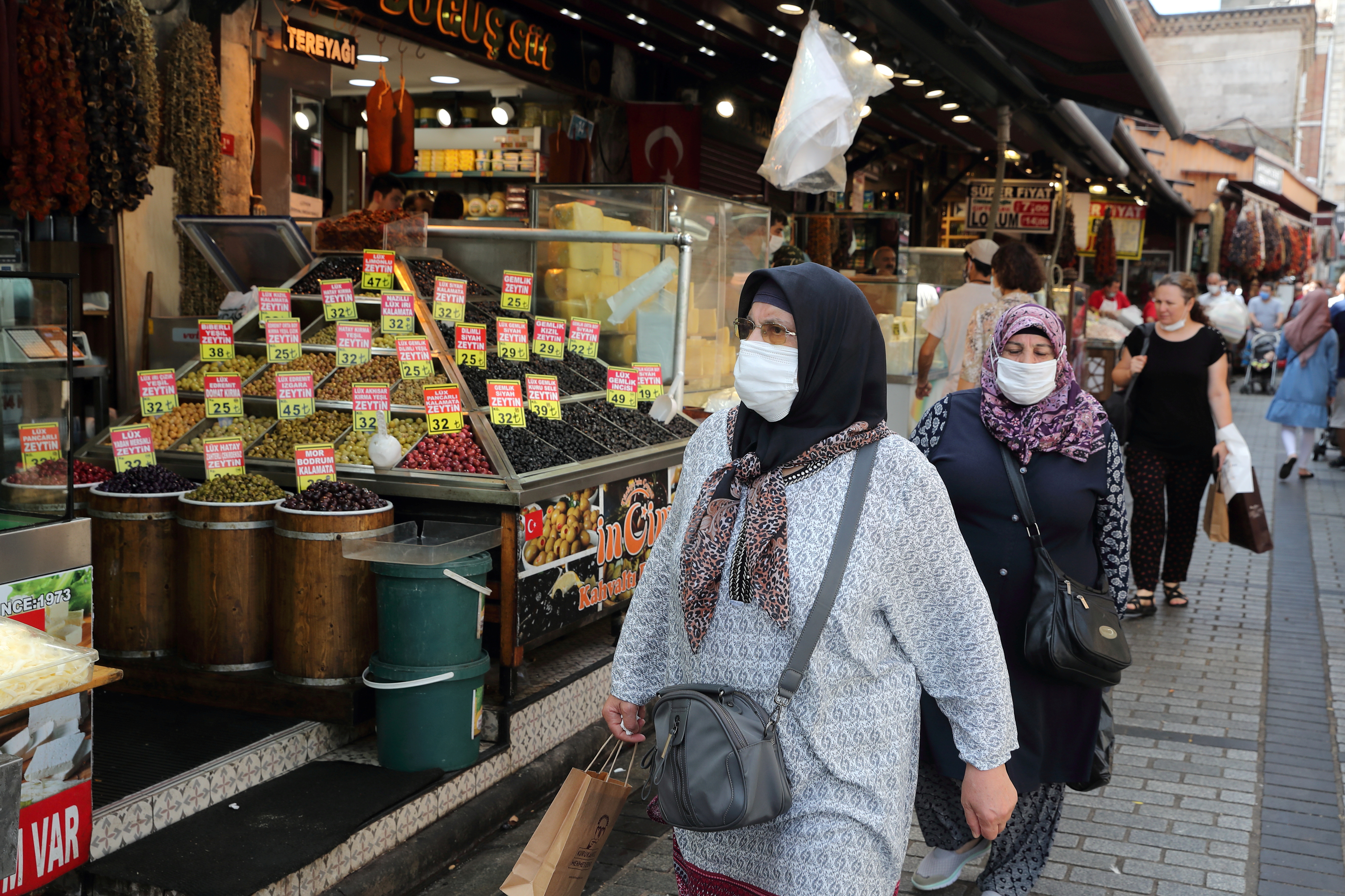 People shop at the Spice Market also known as the Egyptian Bazaar in Istanbul