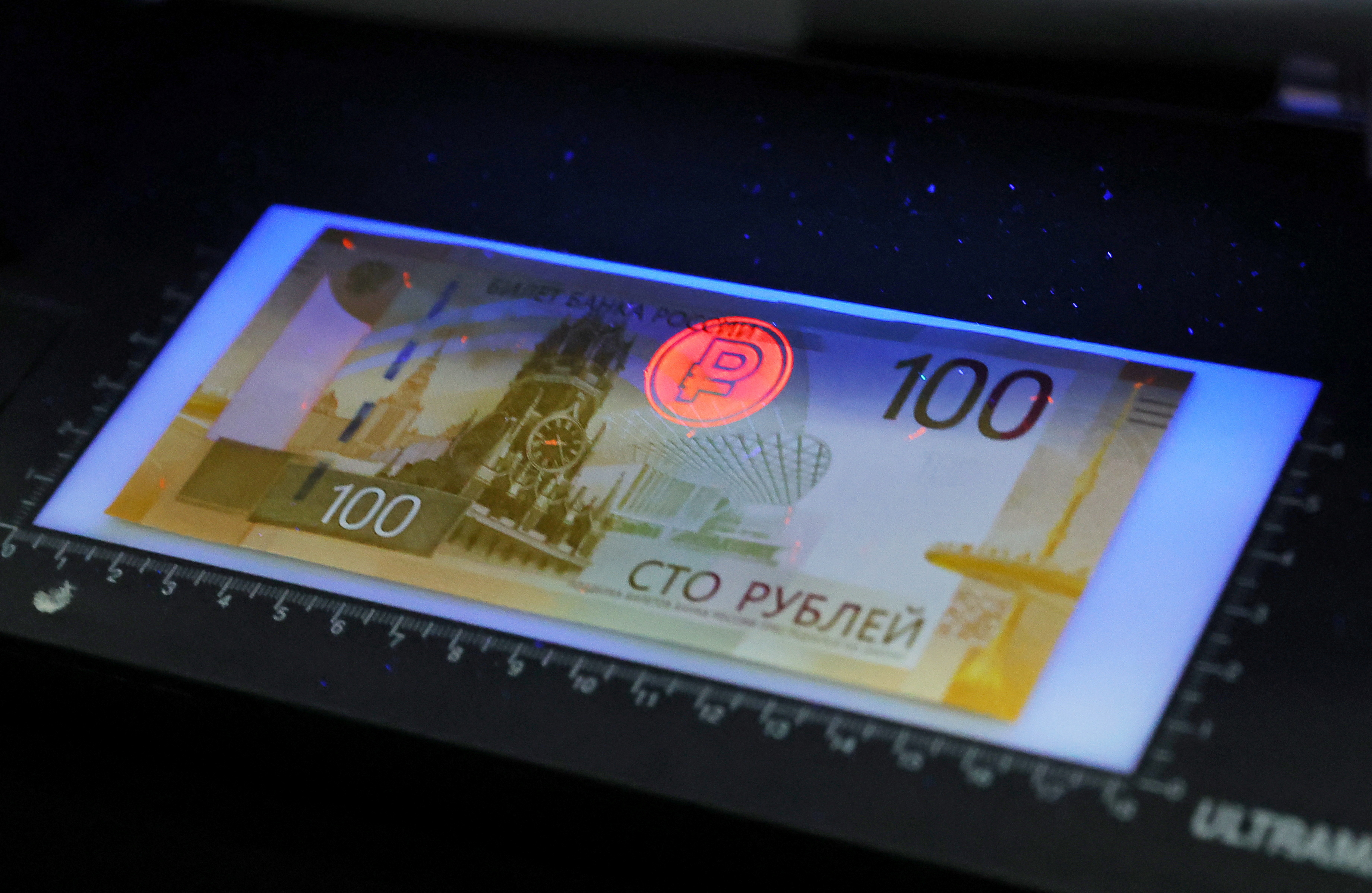 The newly designed Russian 100-rouble banknote is on display during a presentation in Moscow