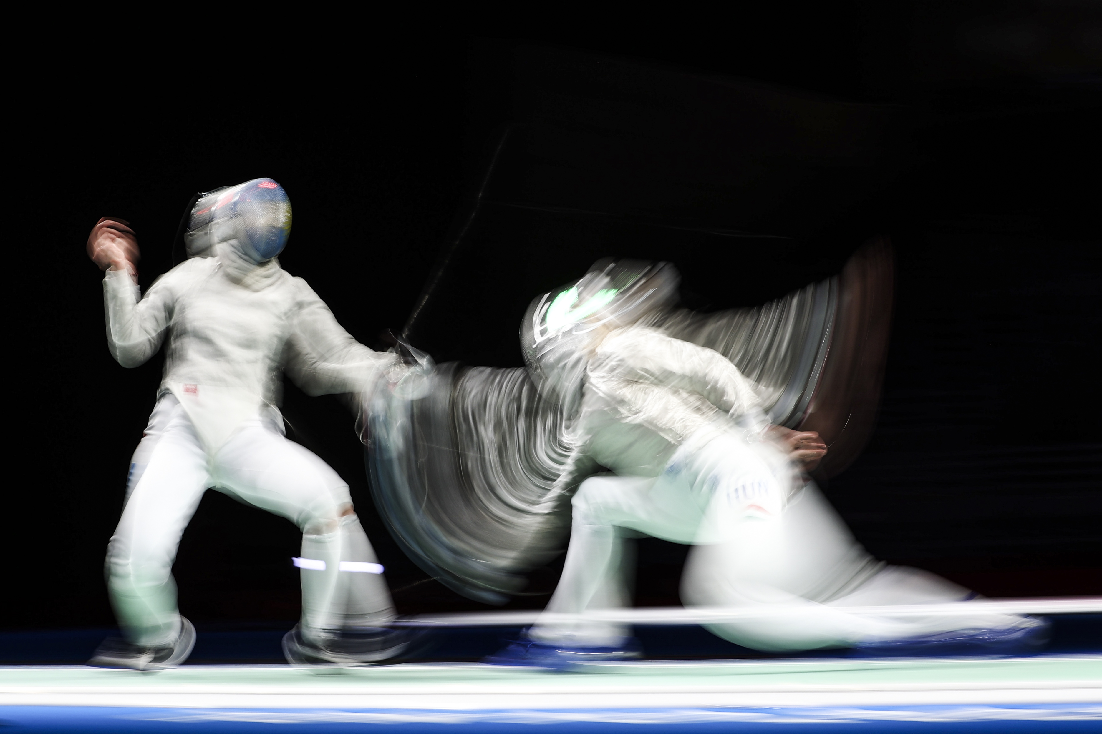 Tokyo 2020 Olympics - Fencing - Women's Individual Sabre - Last 32 - Makuhari Messe Hall B - Chiba, Japan - July 26, 2021. Maria Perez Maurice of Argentina in action against Anna Marton of Hungary REUTERS/Molly Darlington