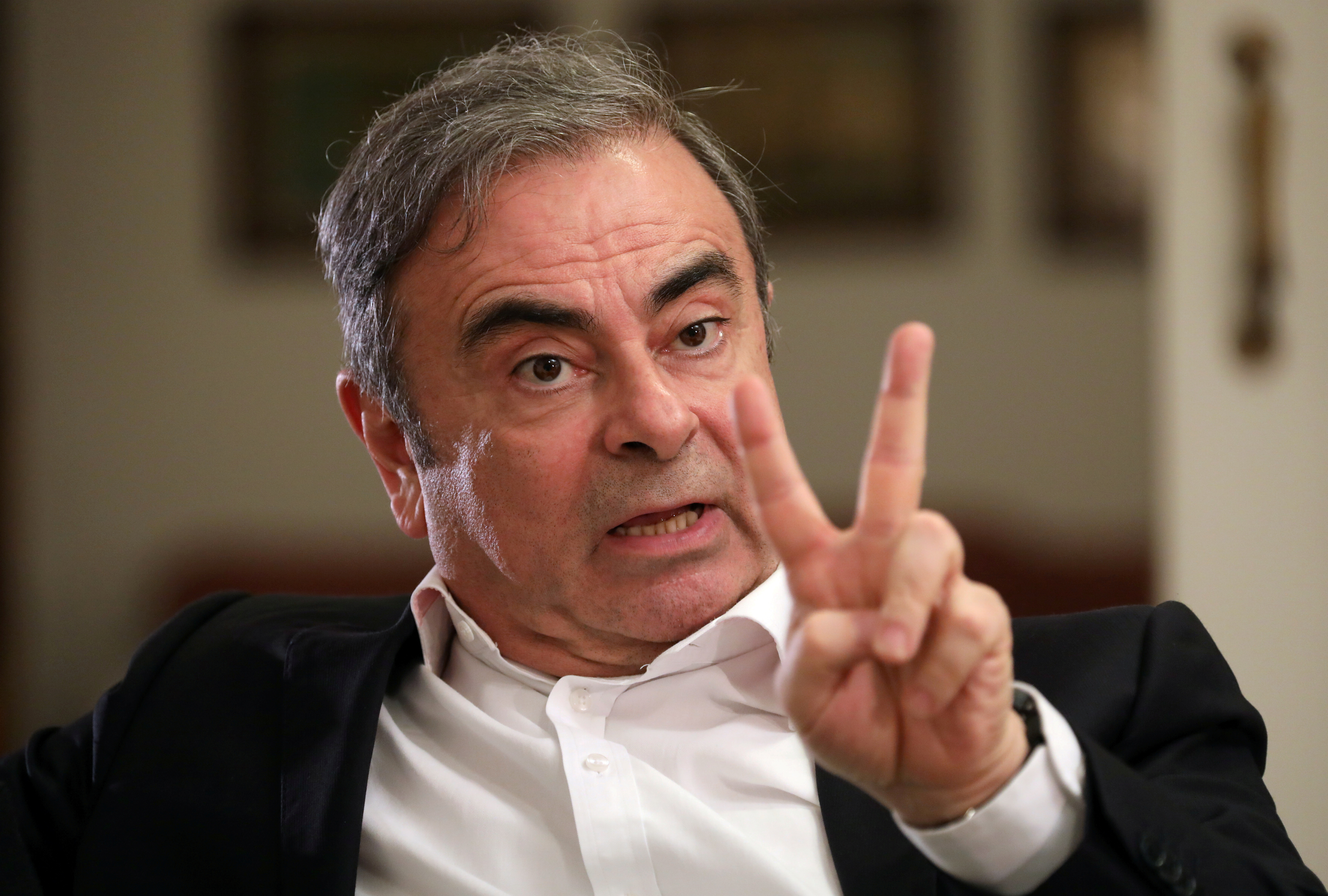 Former Nissan chairman Carlos Ghosn talks during an exclusive interview with Reuters in Beirut