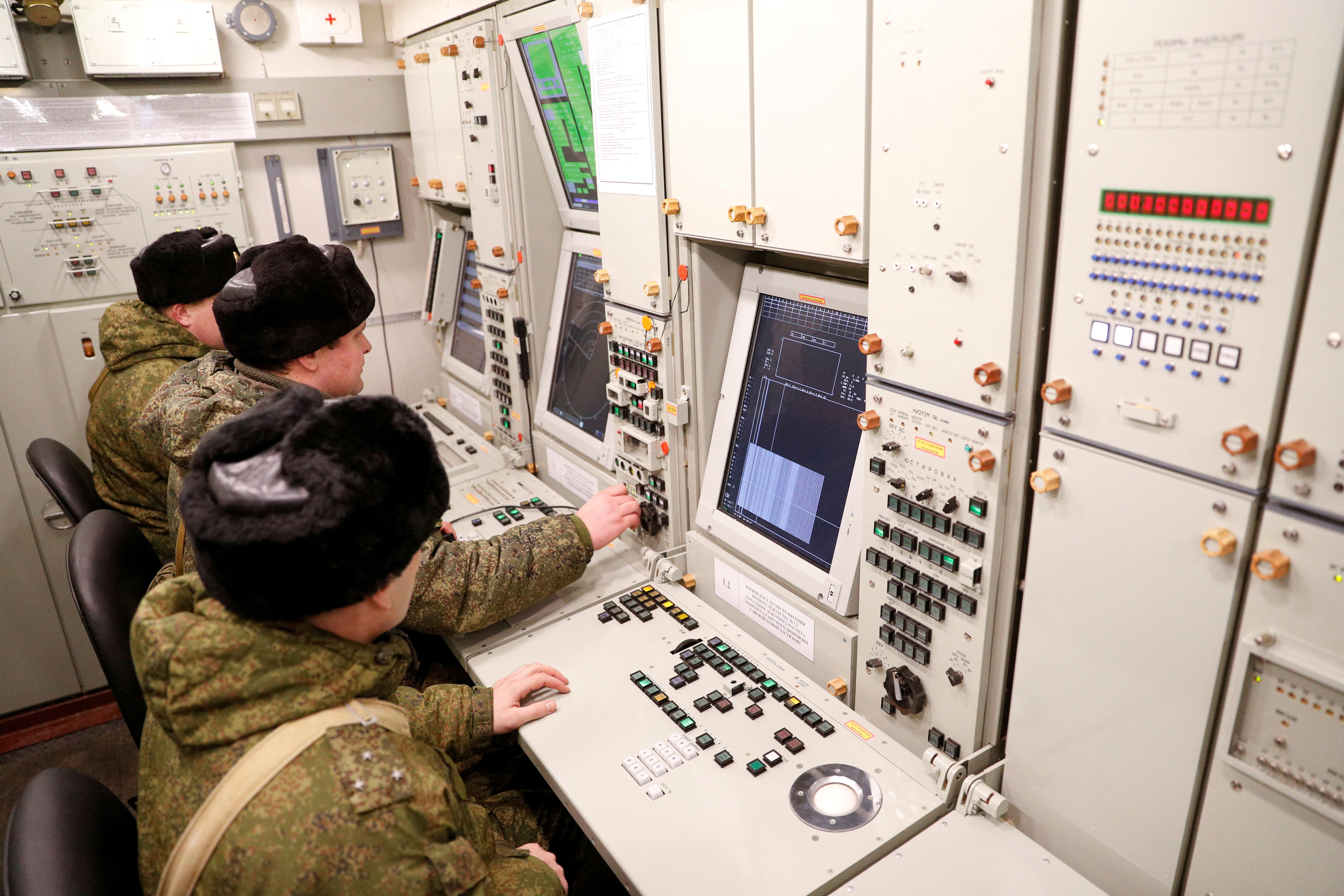 Russian servicemen work inside a command centre after S-400 surface-to-air missiles were deployed near Kaliningrad
