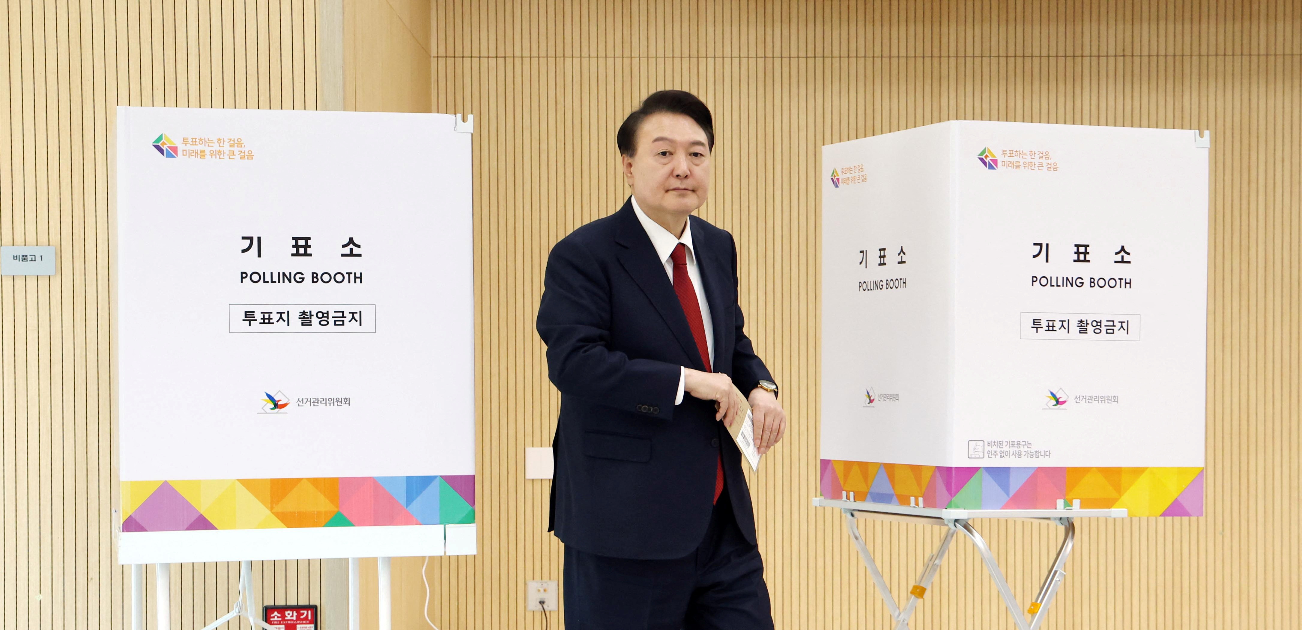 South Korean President Yoon Suk Yeol casts his early vote for 22nd parliamentary election, in Busan