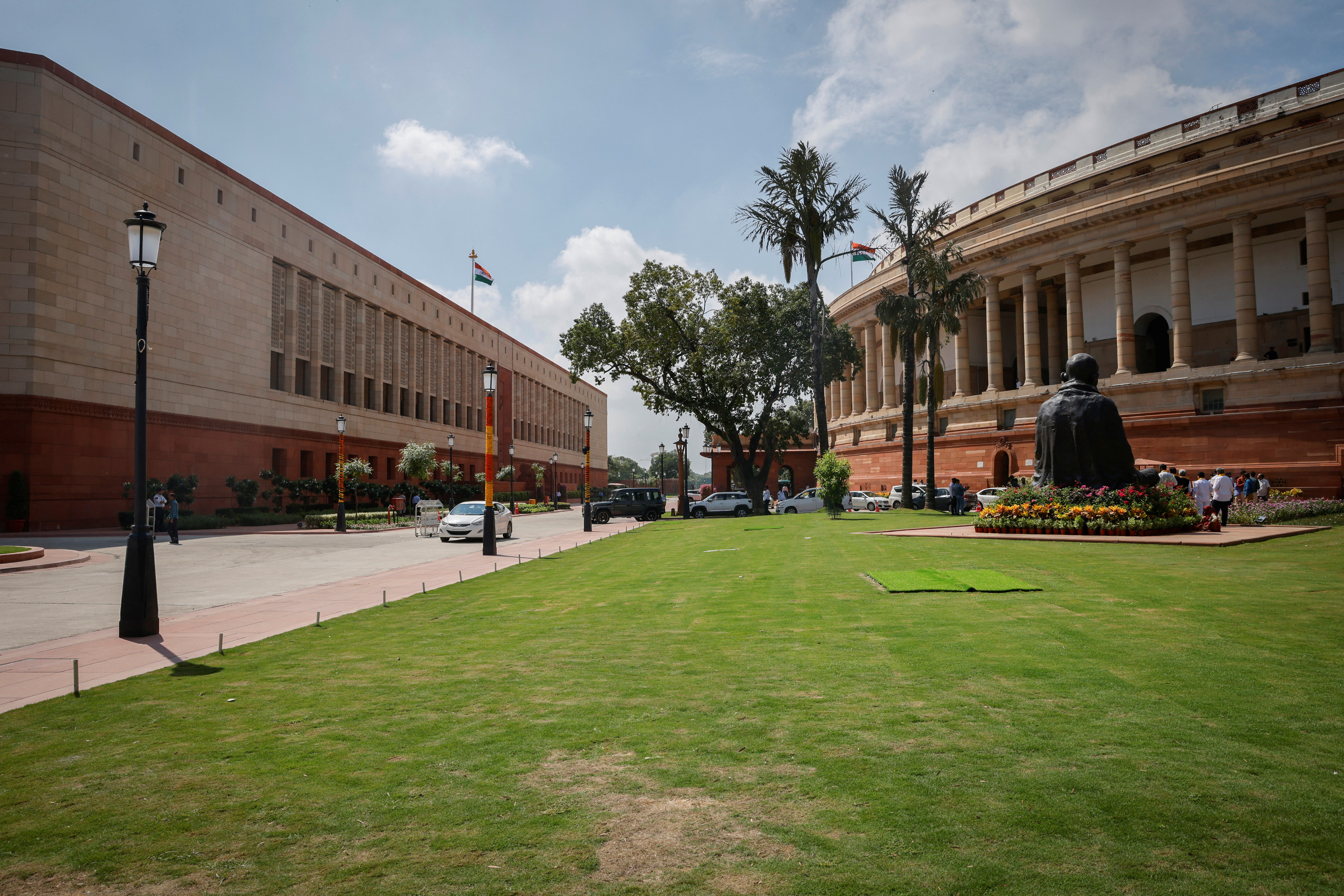 A view shows India's new (L) and old parliament buildings during the first day of the five-day long special session in New Delhi